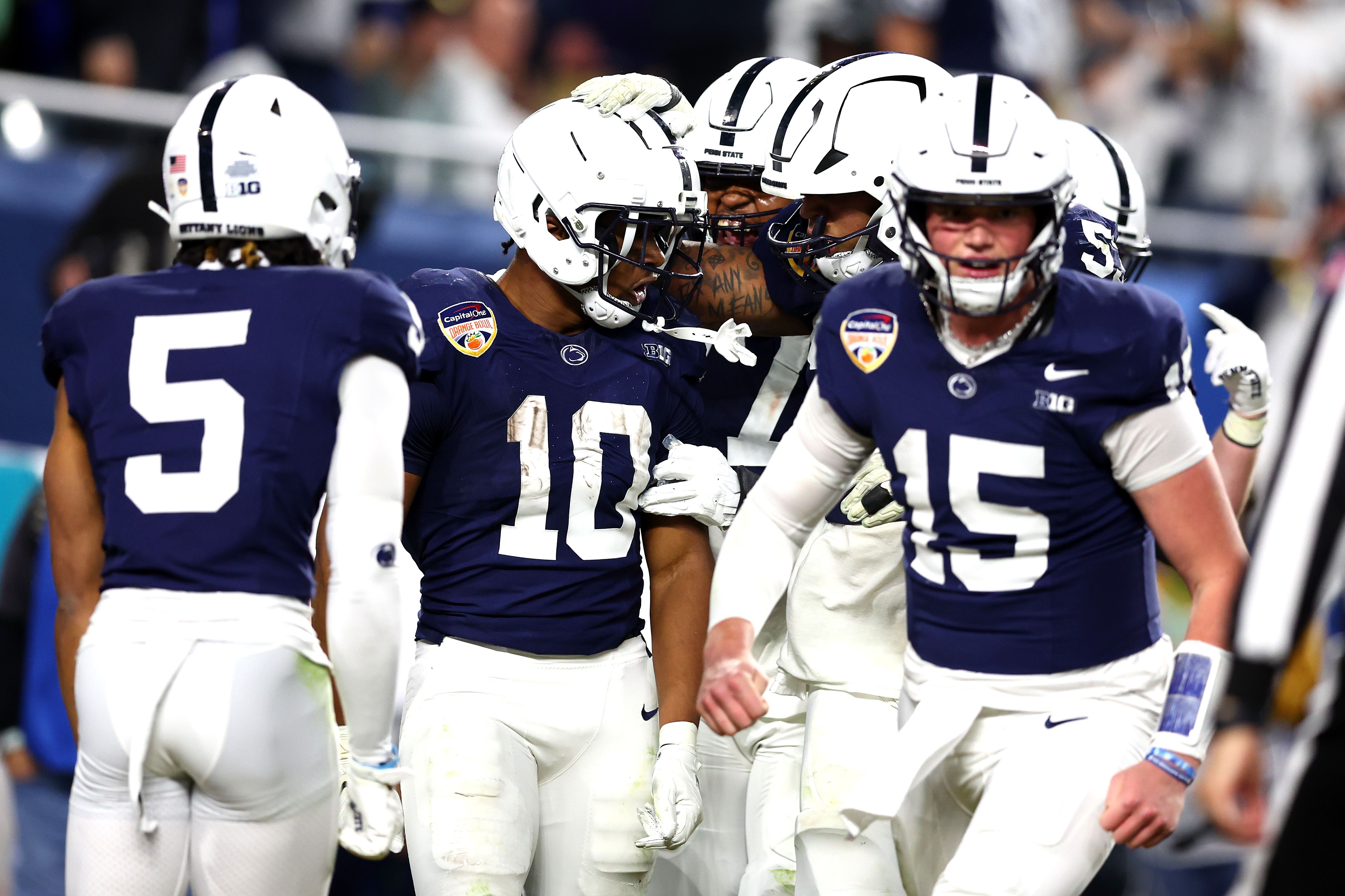 Nicholas Singleton #10 of the Penn State Nittany Lions celebrates with teammates after scoring a touchdown during the fourth quarter against the Notre Dame Fighting Irish in the Capital One Orange Bowl at Hard Rock Stadium on January 09, 2025 in Miami Gardens, Florida. 