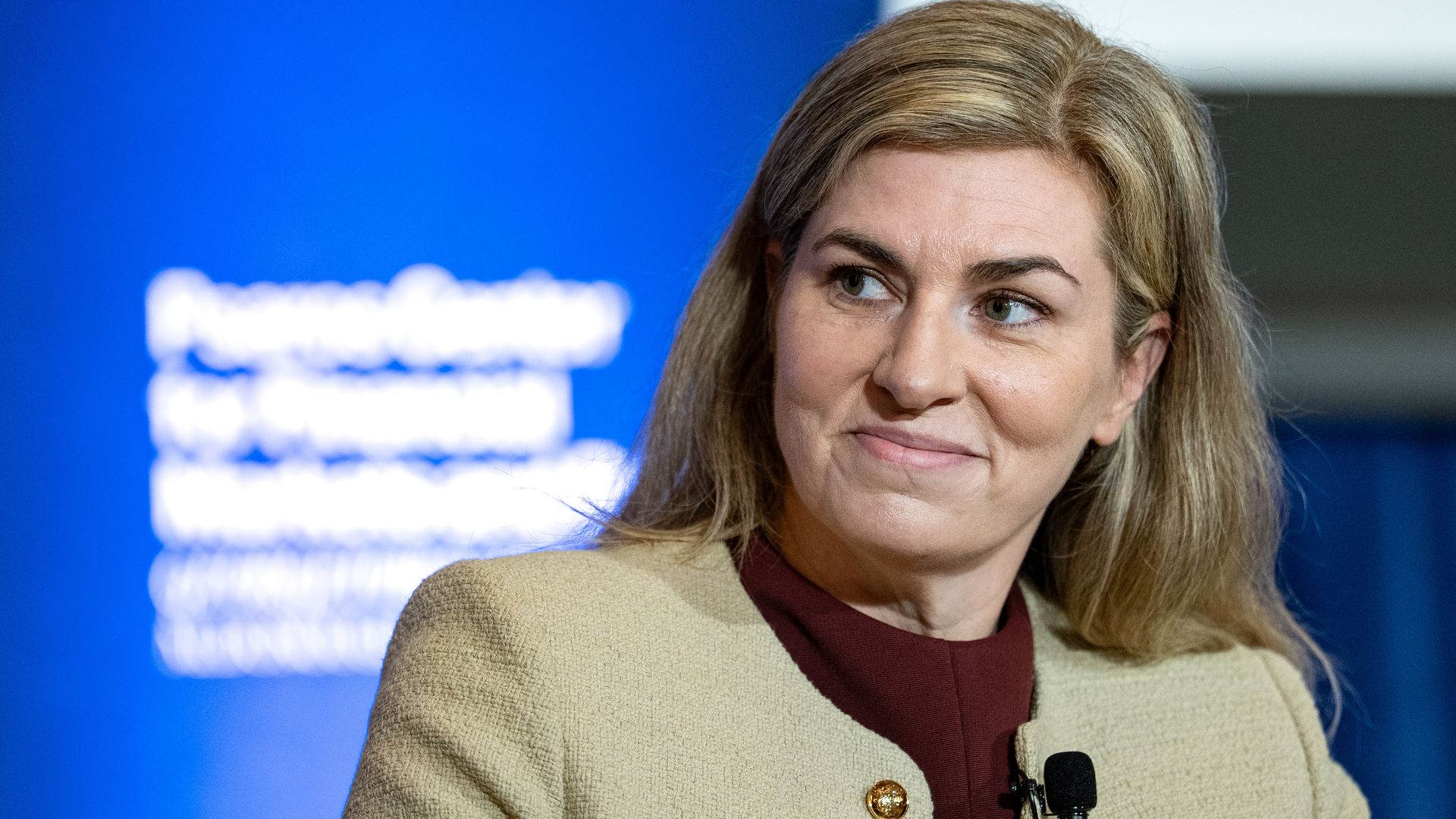 Lynne Fitzpatrick, president and chief financial officer of CME Group, looking to her right at a conference.