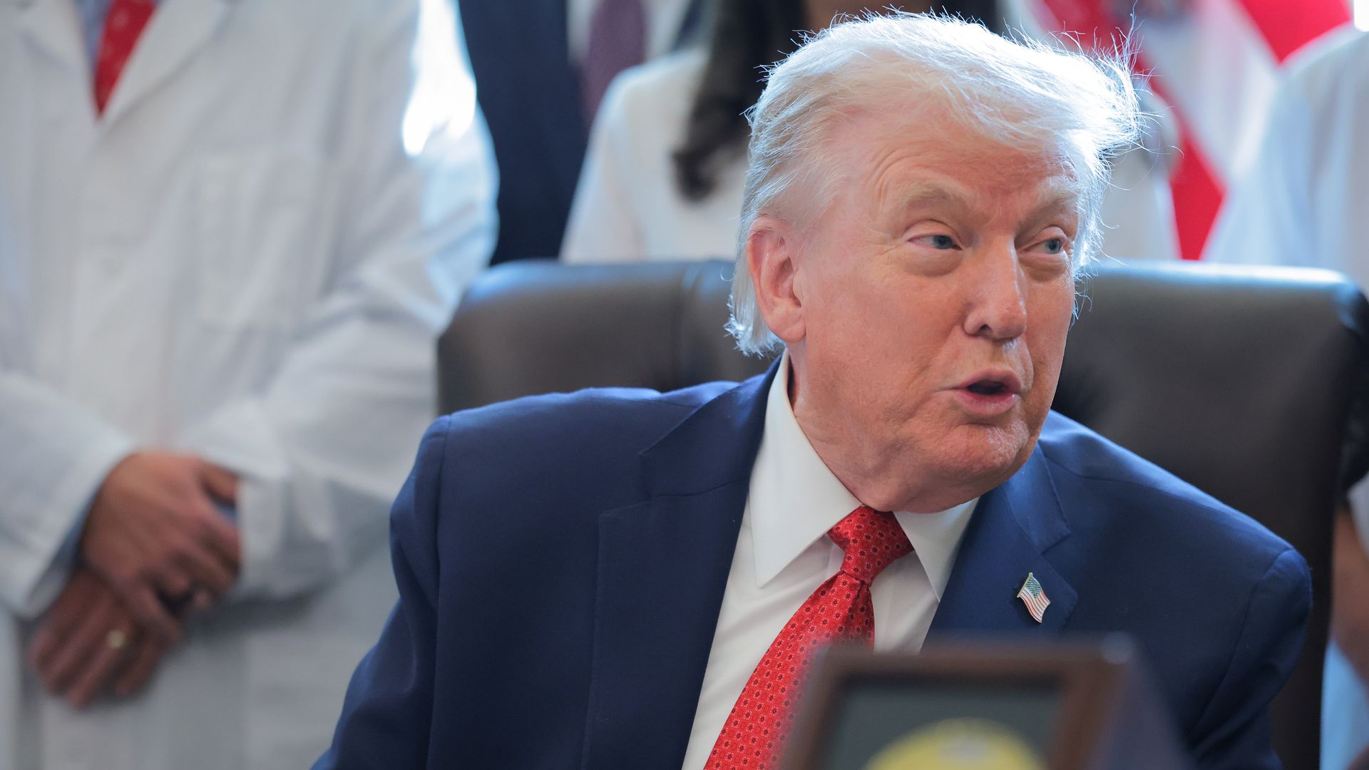 President Donald Trump speaks at the Resolute Desk in the Oval Office before signing an executive order on marijuana reclassification, Dec. 18, 2025.