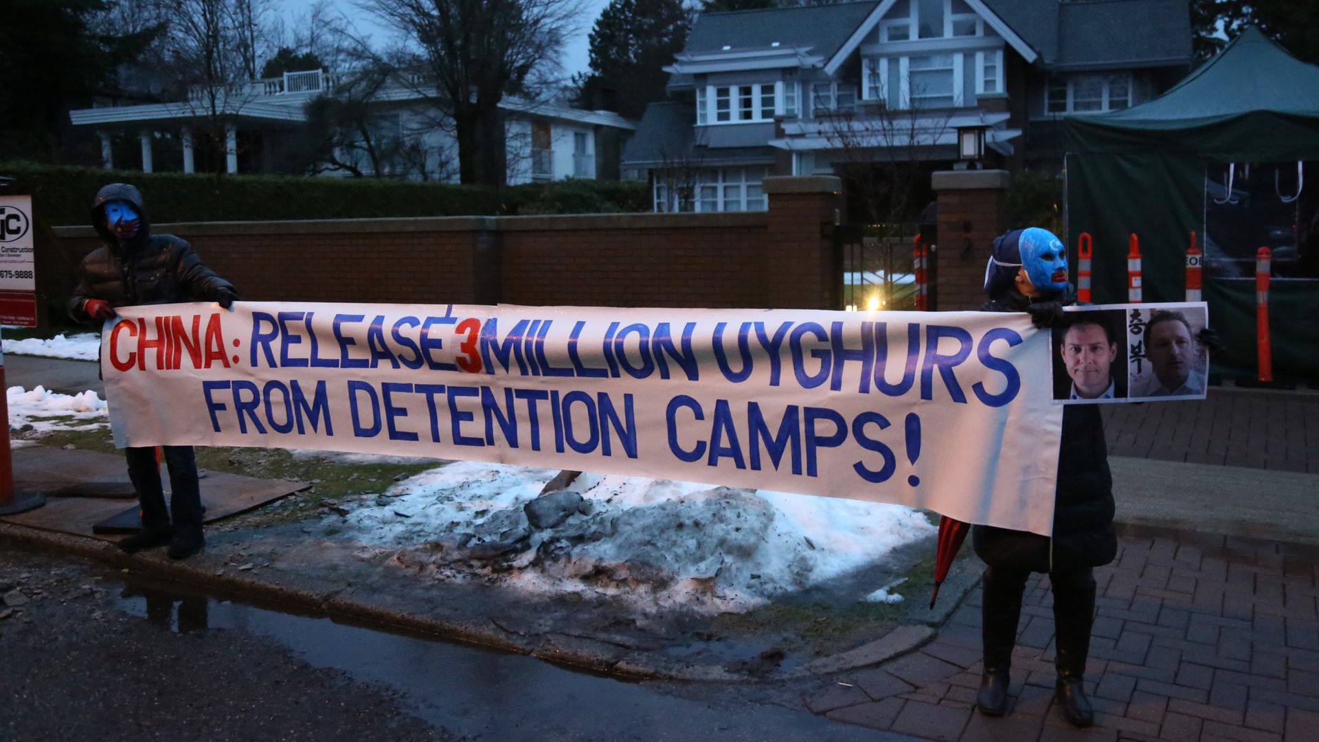 Uyghur activists protest China's treatment of Uyghurs outside the house of Huawei Technologies Chief Financial Officer Meng Wanzhou