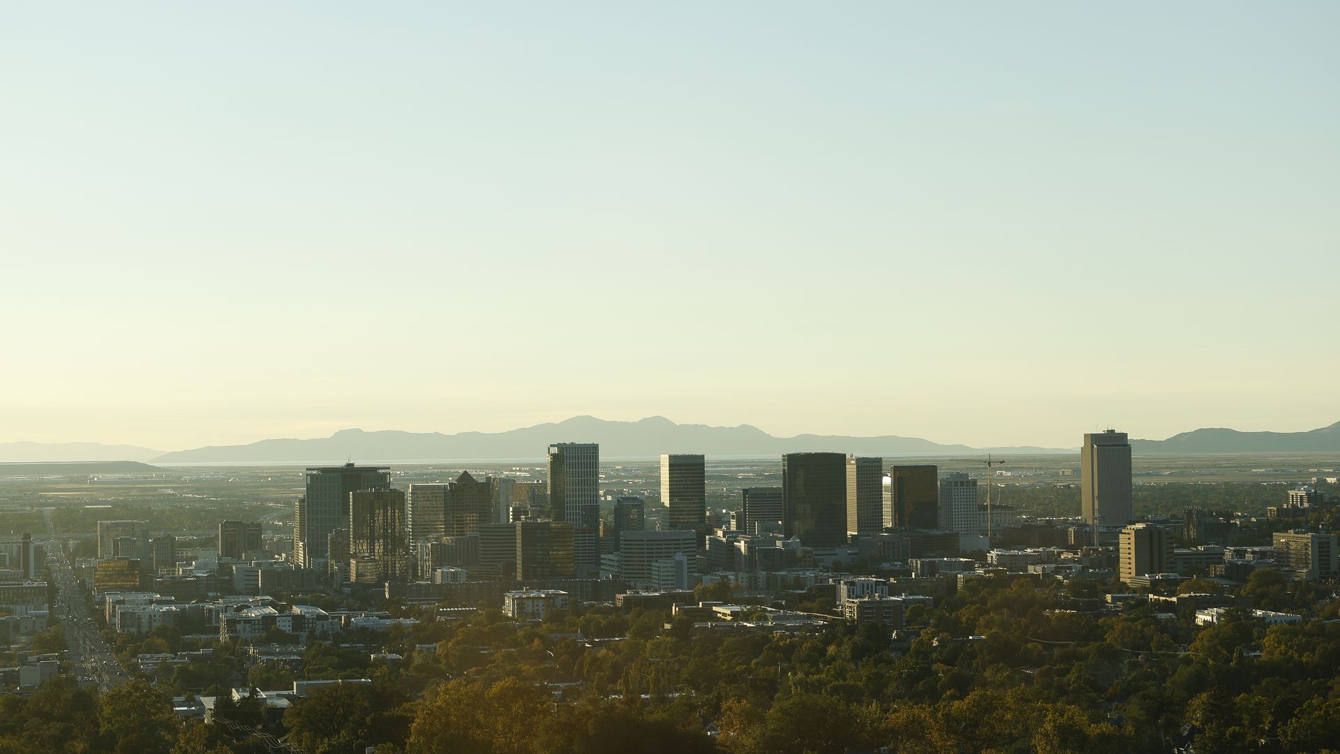 SALT LAKE CITY, UT - OCTOBER 19: The skyline of downtown Salt Lake City taken from the top of the stadium prior to a game between the Utah Utes and TCU Horned Frogs at Rice Eccles Stadium on October 19, 2024 in Salt Lake City, Utah.