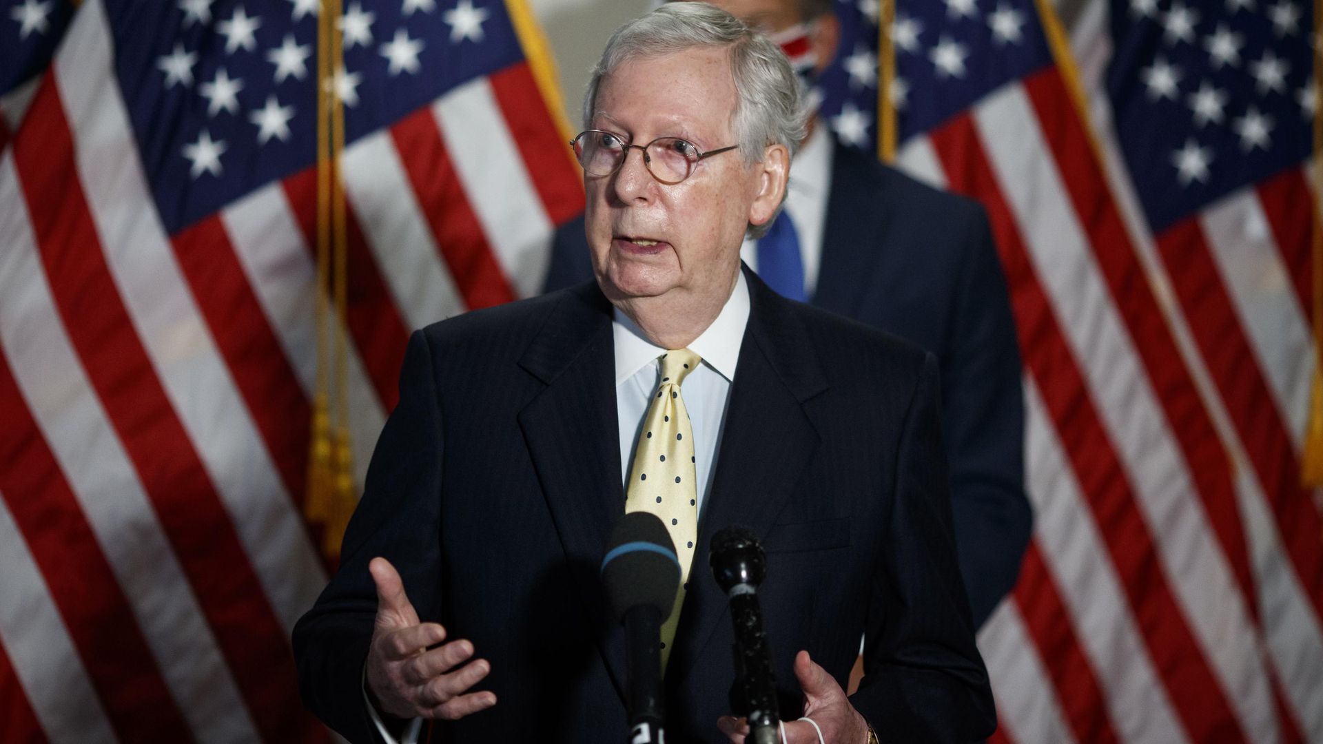 Mitch McConnell speaks at a podium.
