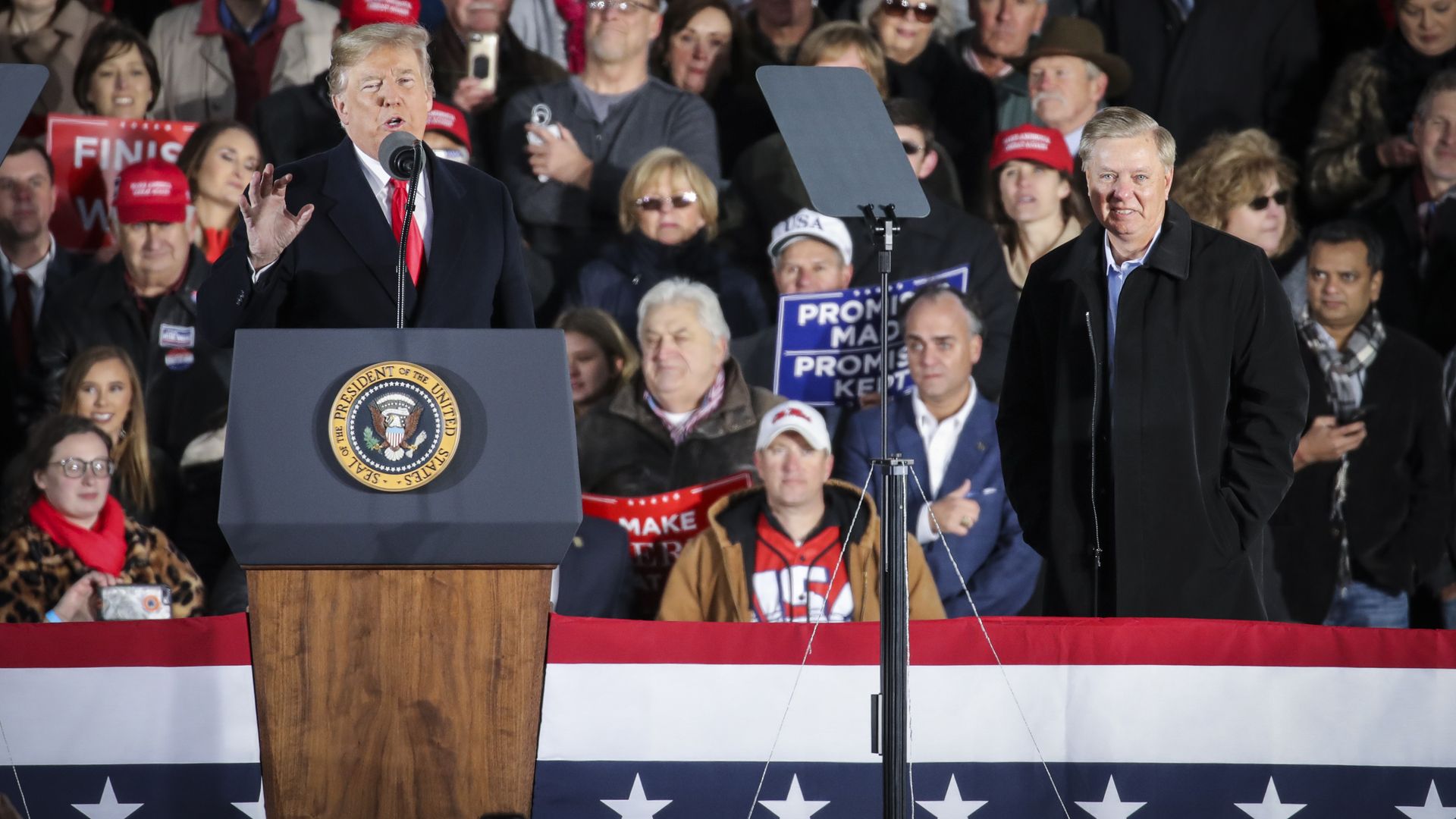 President Donald Trump introduces Sen. Lindsey Graham (R-SC) during a rally at the Tupelo Regional Airport
