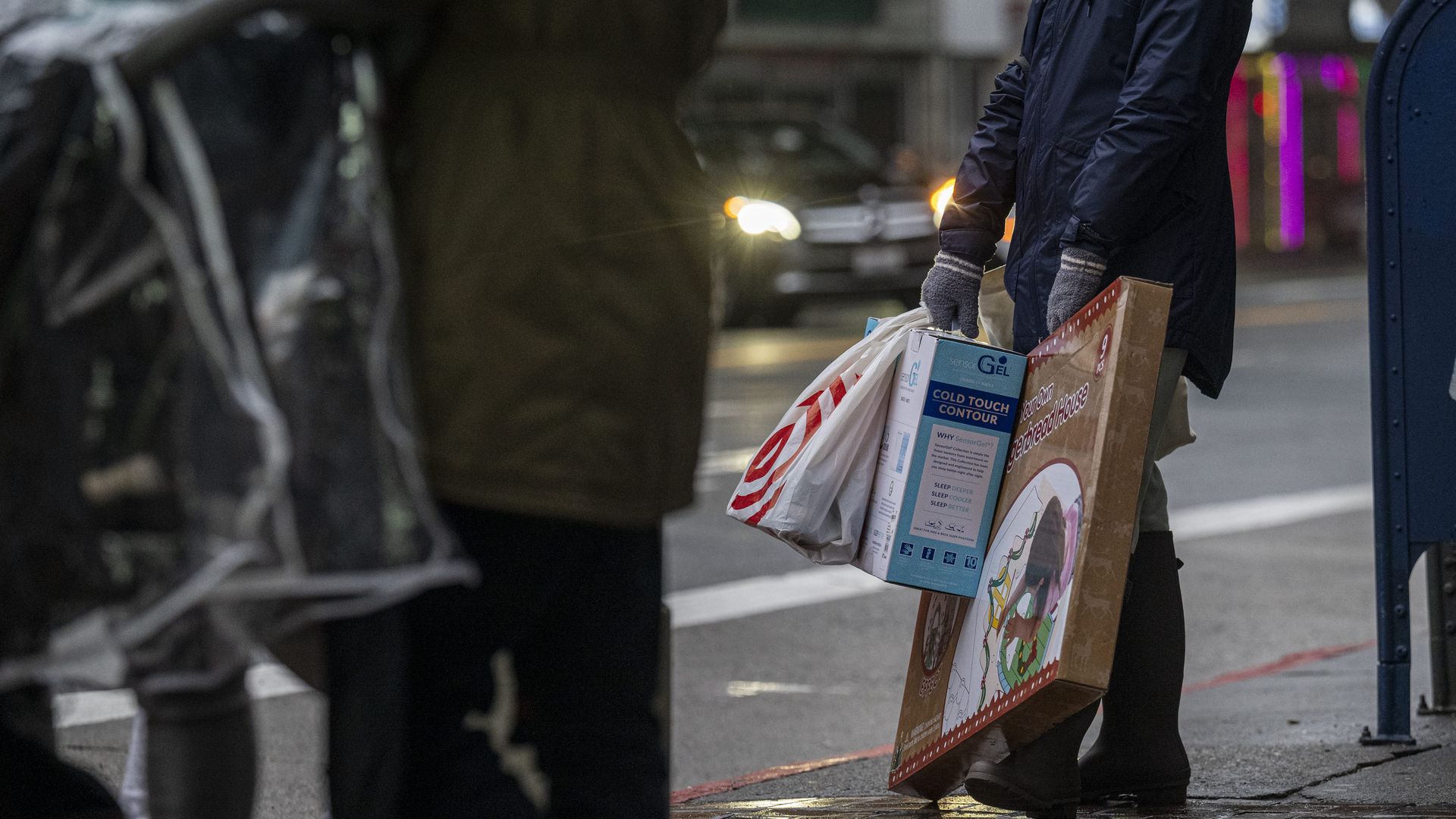 Shoppers hold bags in San Francisco, California, U.S., on Wednesday, Dec. 22, 2021