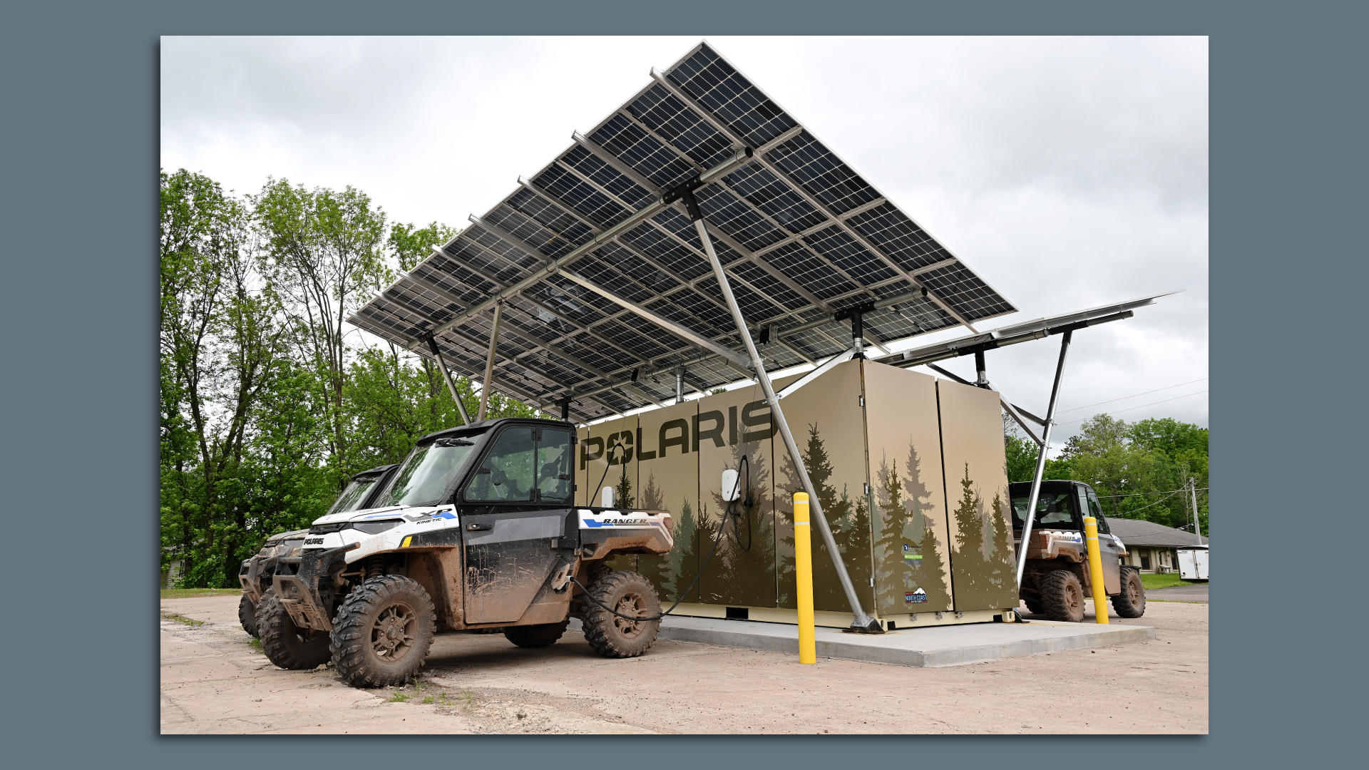 Image of a Polaris RANGER XP Kinetic off-road vehicle charging at one of the four new off-road charging stations in Michigan's Upper Peninsula.