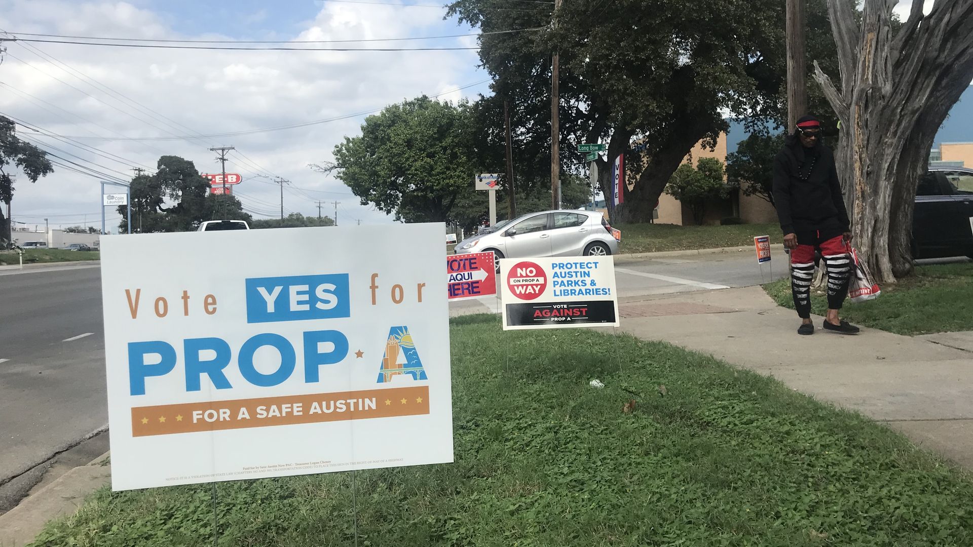 Dueling campaign signs outside a voting precinct in South Austin.