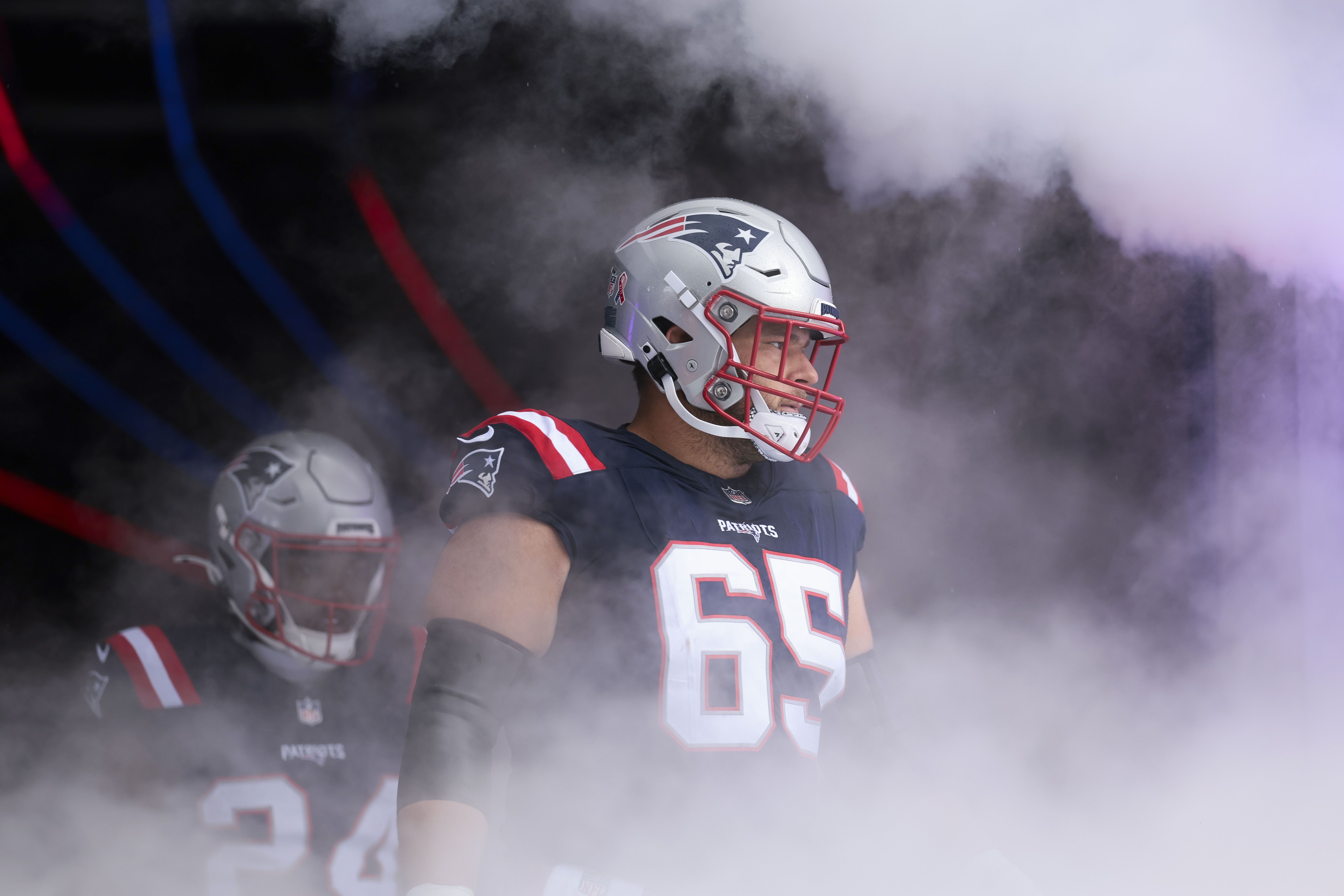 Garrett Bradbury #65 of the New England Patriots walks onto the field prior to the NFL game against the Las Vegas Raiders at Gillette Stadium on September 7, 2025 in Foxborough, Massachusetts.