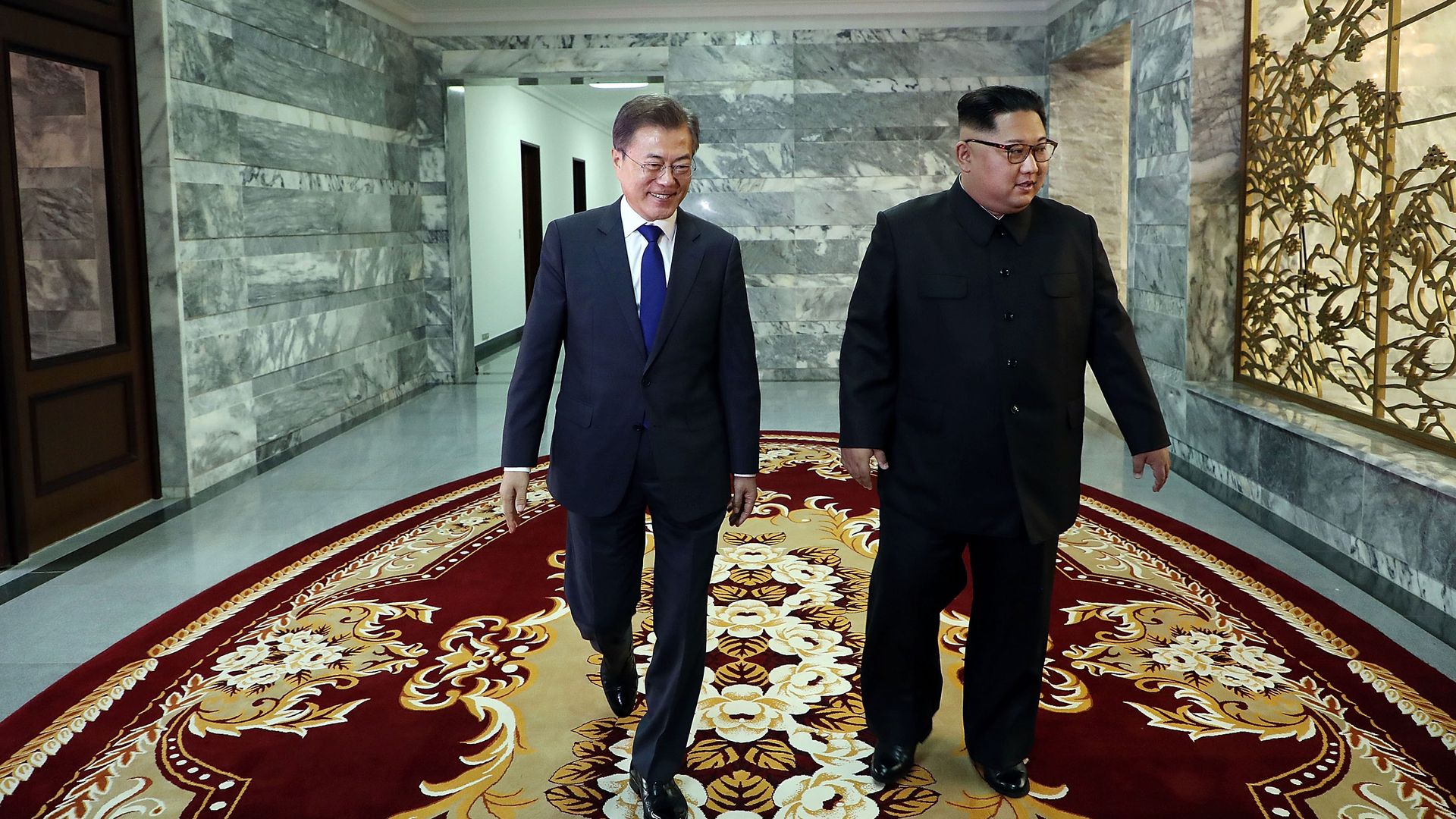 South Korean President Moon Jae-in walks with North Korean leader Kim Jong-un during their meeting on Saturday.