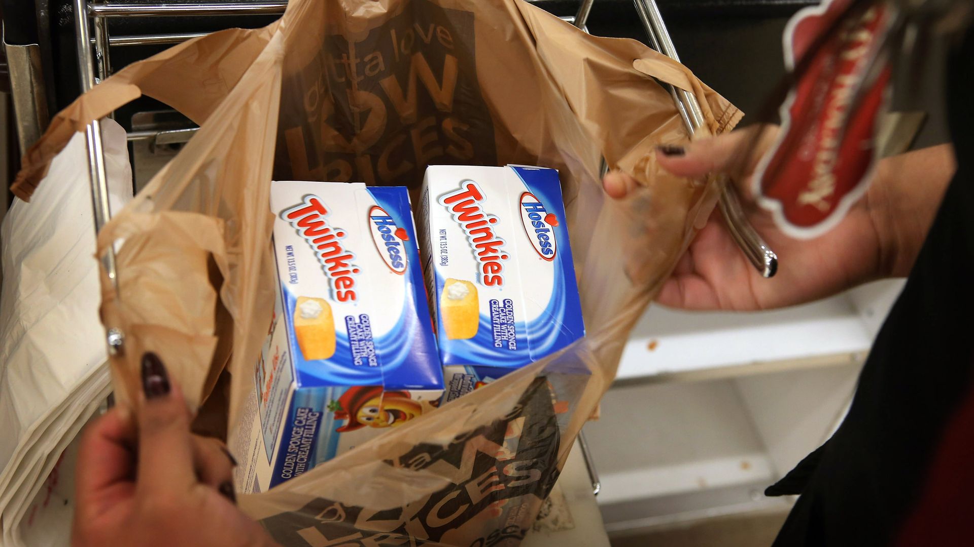A customer buys boxes of Hostess snacks.