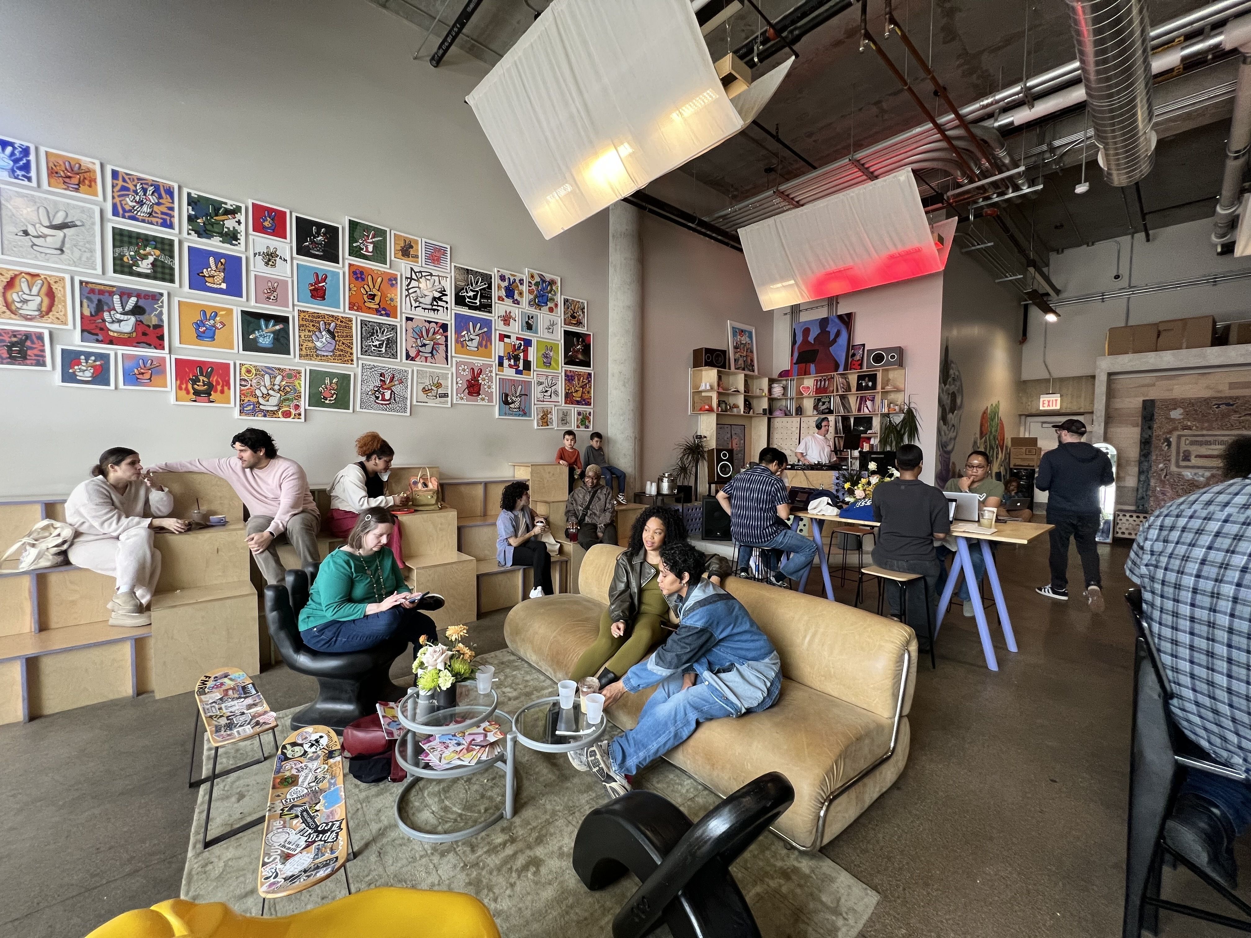 Photo of a room with couches, blocks and skateboards for tables. 