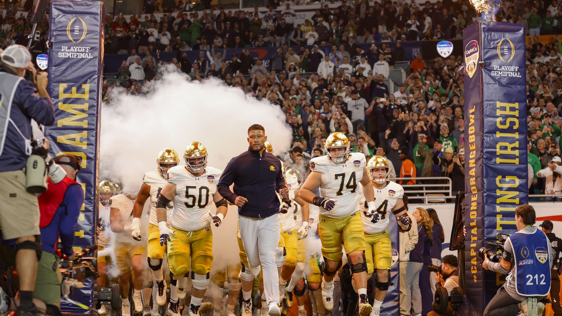 Notre Dame head coach Marcus Freeman leads his team on to the field before the Penn State Nittany Lions versus the Notre Dame Fighting Irish College Football Playoff Semifinal at the Orange Bowl on January 9, 2025 at Hard Rock Stadium in Miami Gardens, Fl.