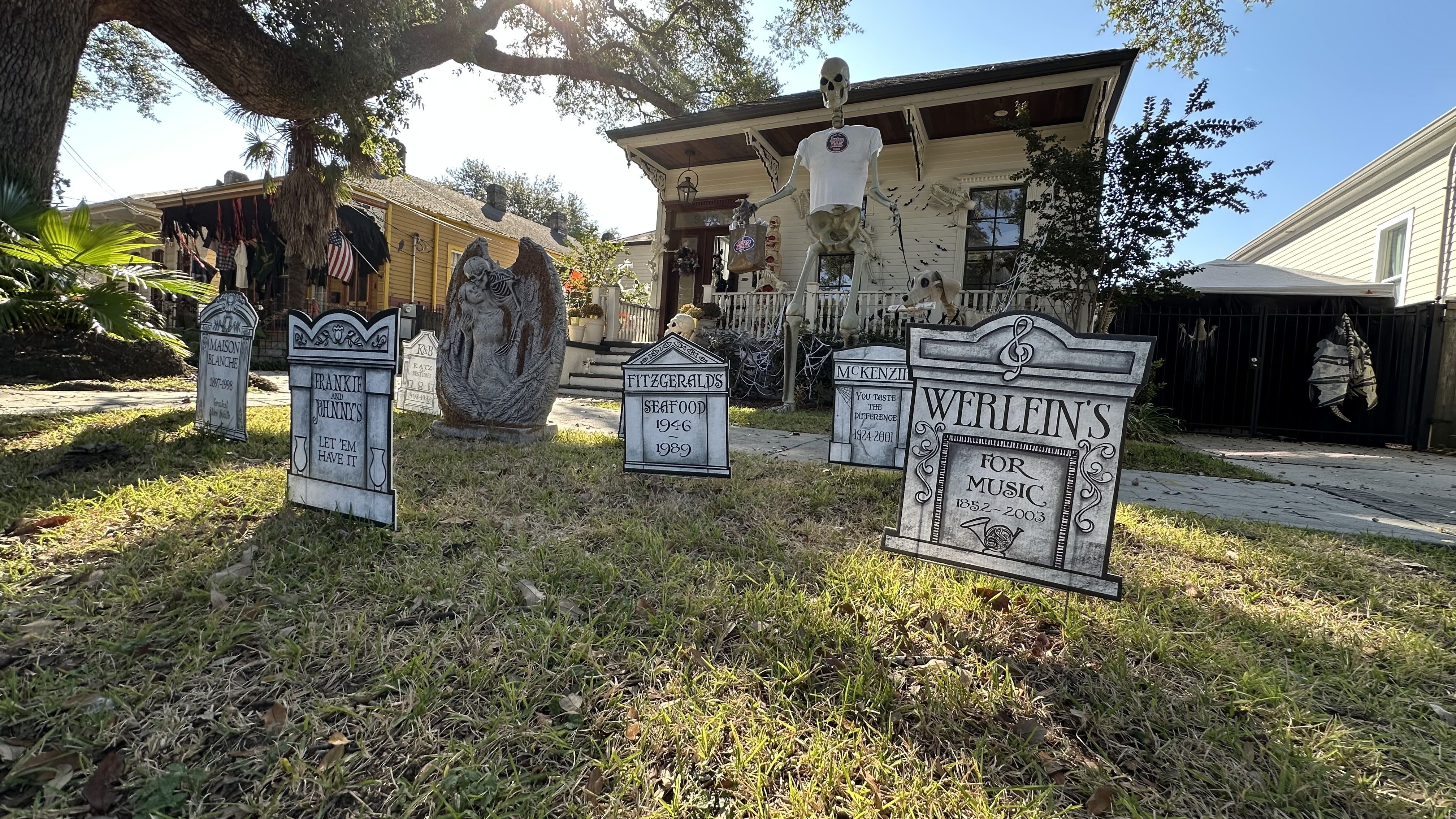 A photo of a house with cemetery-style Halloween decorations.