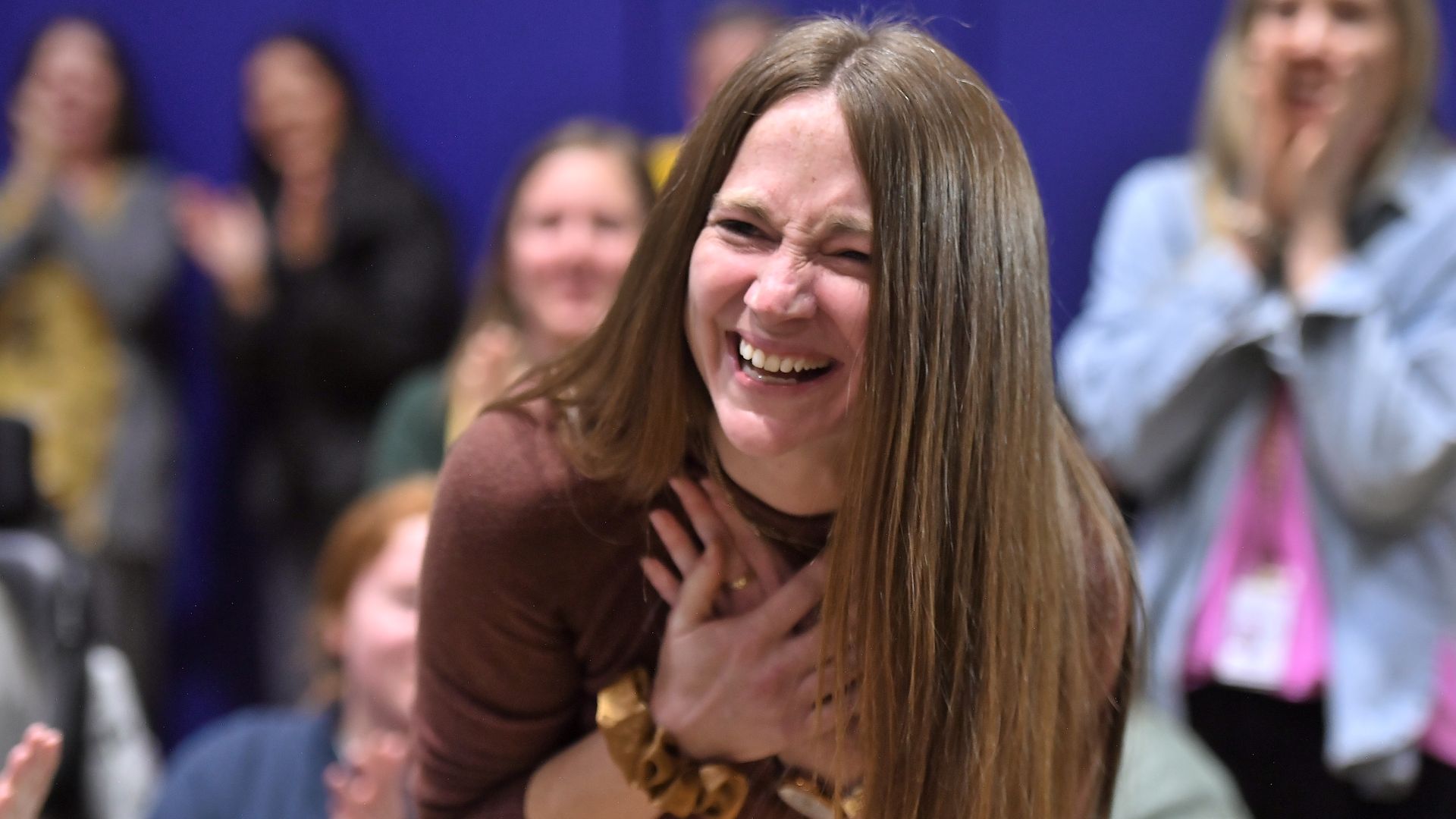 Photo shows Kelly Ryan reacting to winning a Milken award