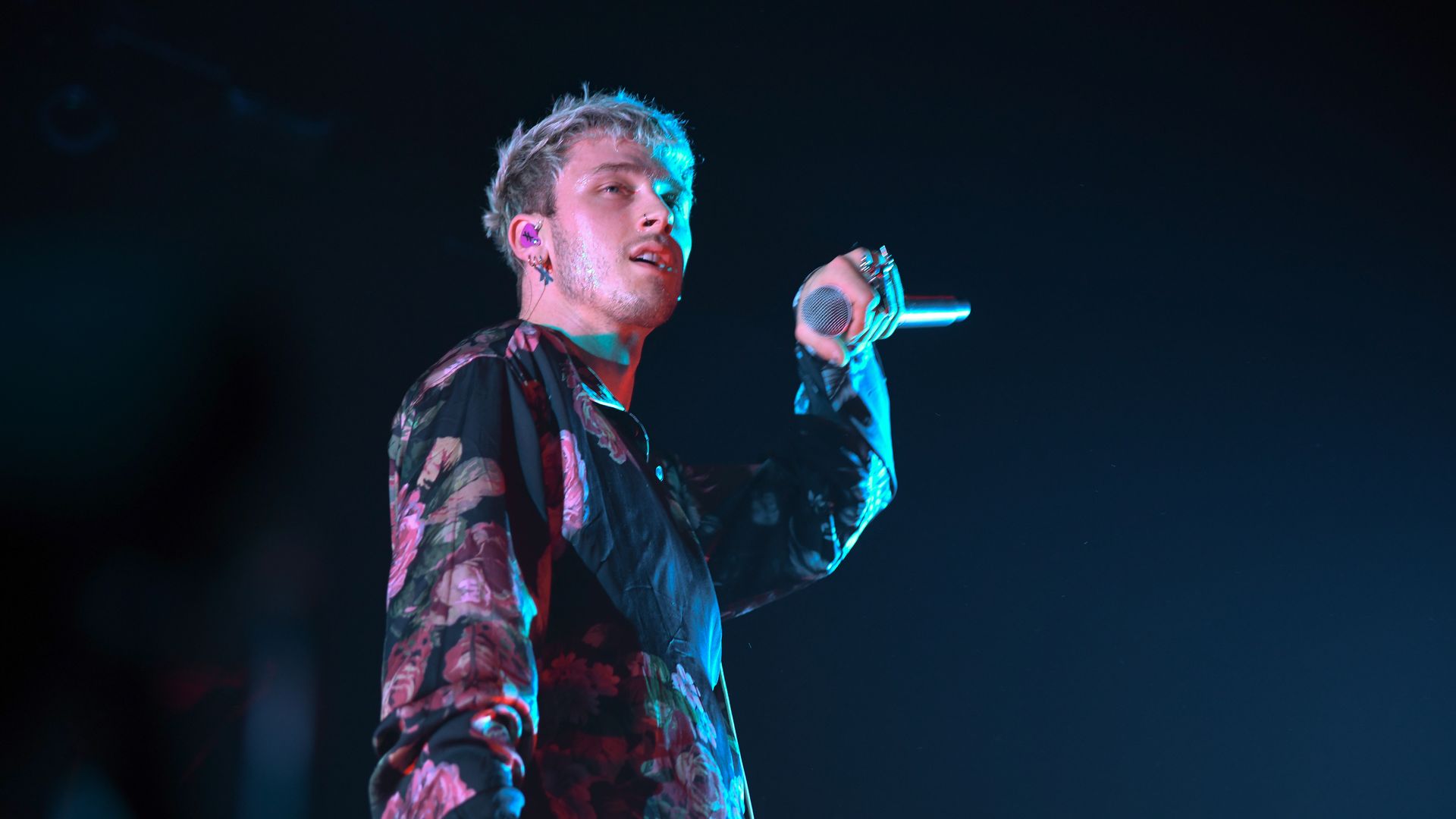 Machine Gun Kelly performs on stage. 