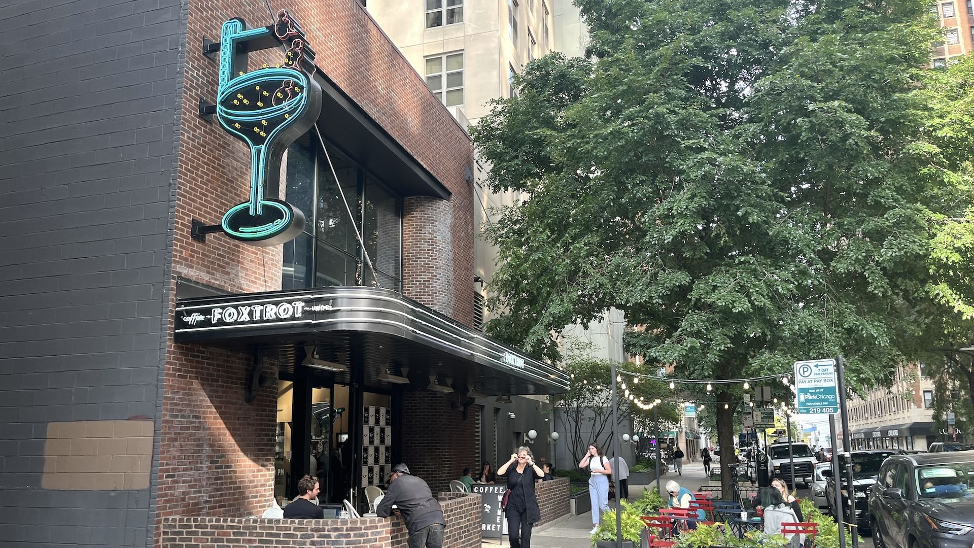 Art deco style building with a neon martini sign.