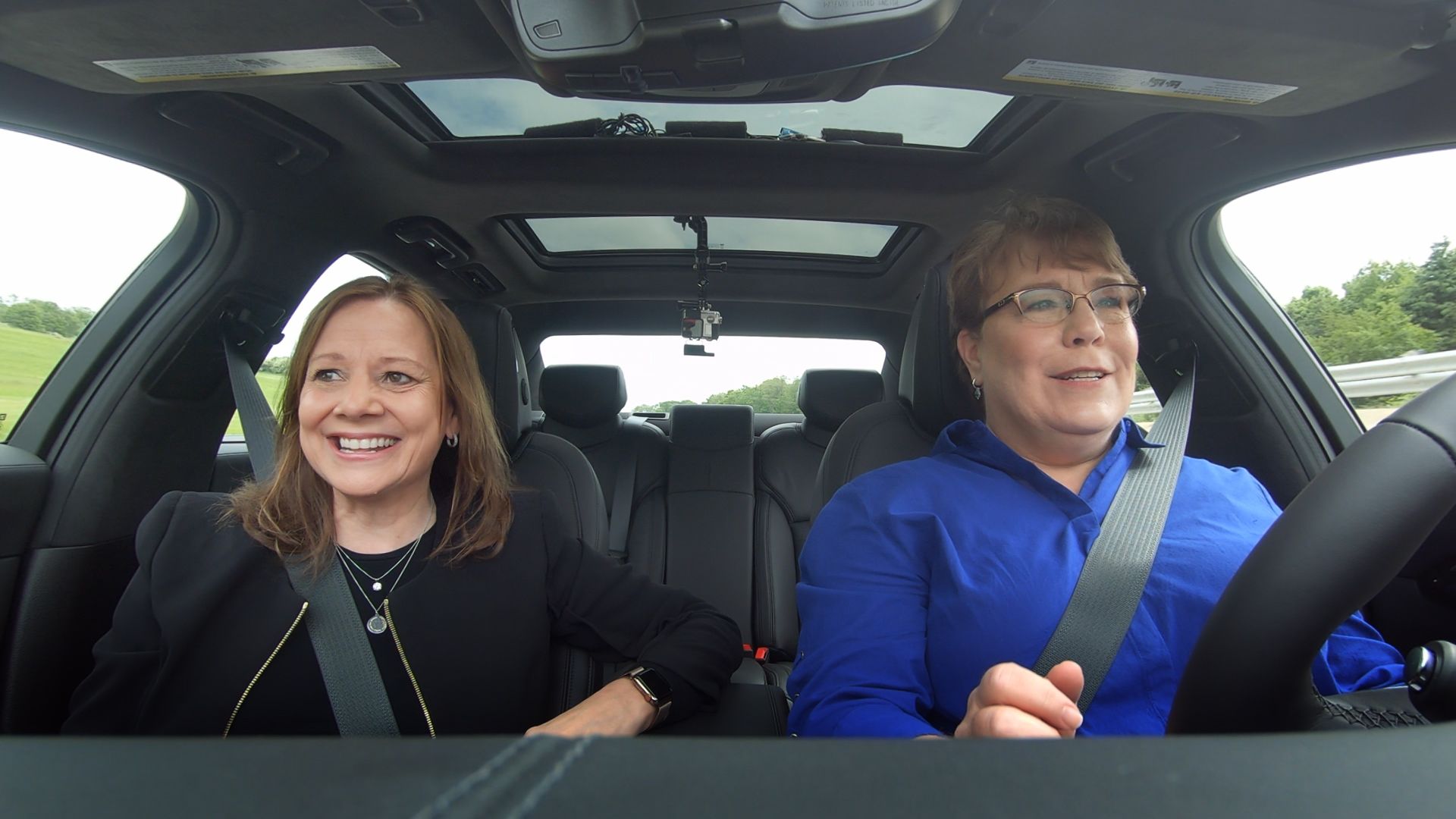 Image of GM CEO Mary Barra and Axios reporter Joann Muller driving in a car