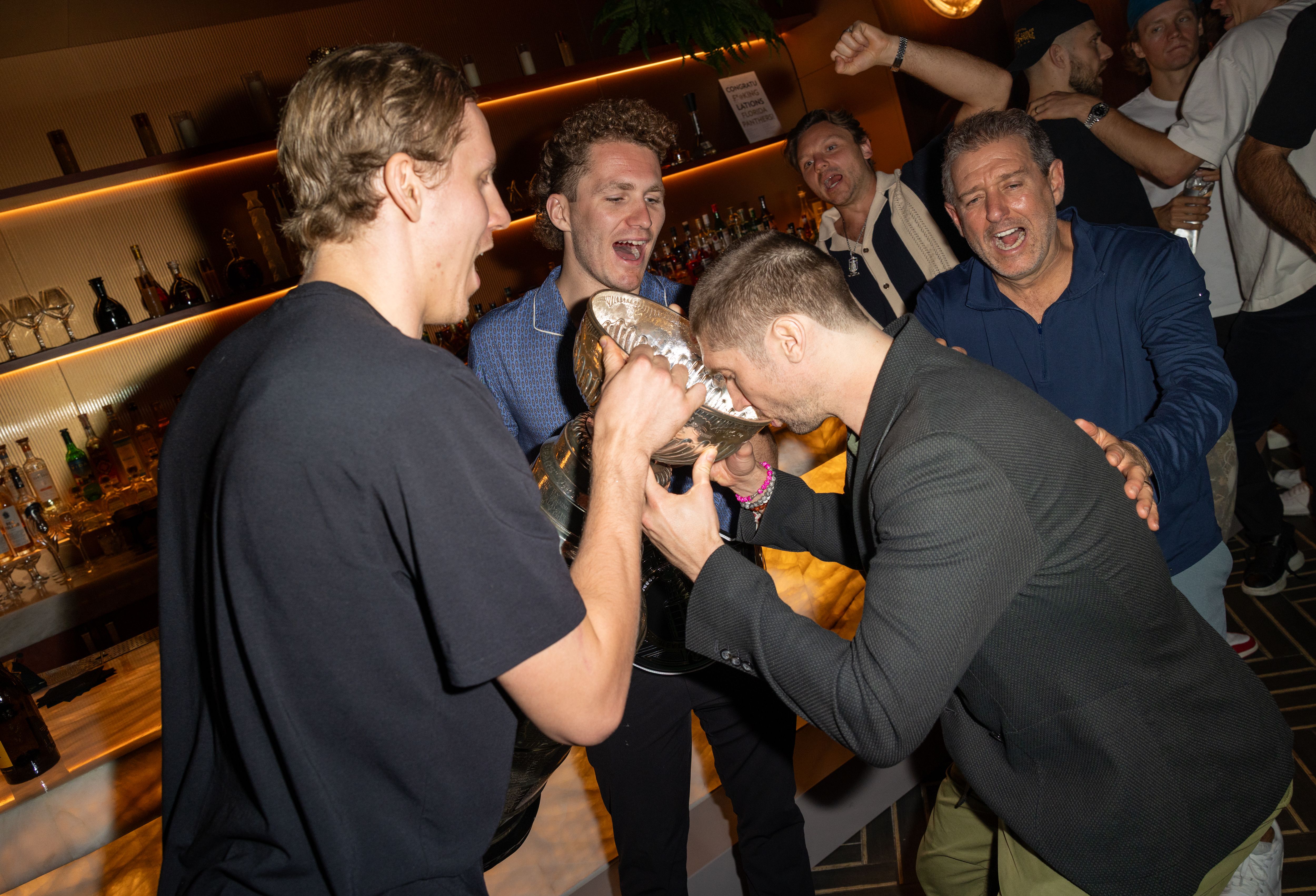 MIAMI, FLORIDA - JUNE 19: Niko Mikkola, Matthew Tkachuk and Sergei Bobrovsky of the Florida Panthers are seen celebrating their 2025 Stanley Cup win at Maple & Ash on June 19, 2025 in Miami, Florida. (Photo by Alexander Tamargo/Getty Images for Maple Hospitality Group)