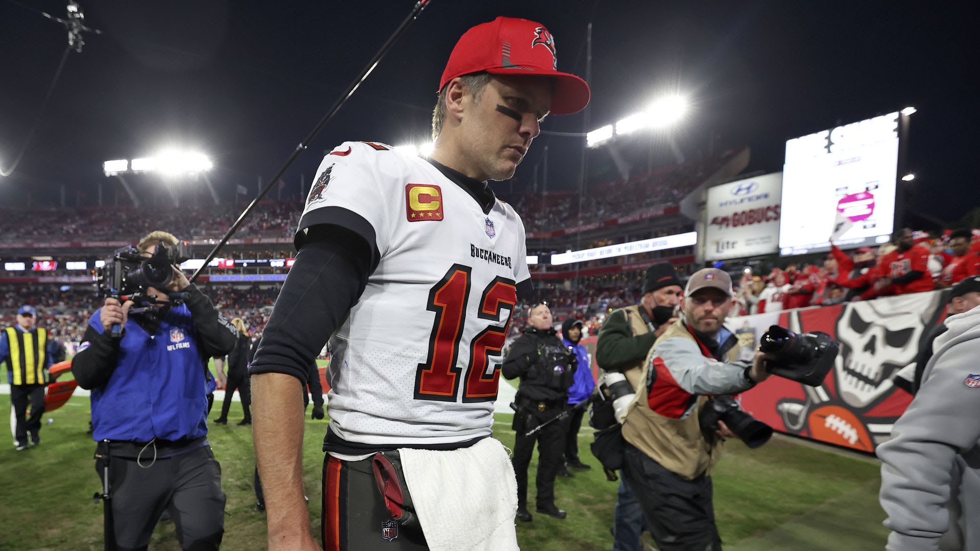 Tom Brady leaves the field after the Bucs lost the Los Angeles Rams in the divisional round.