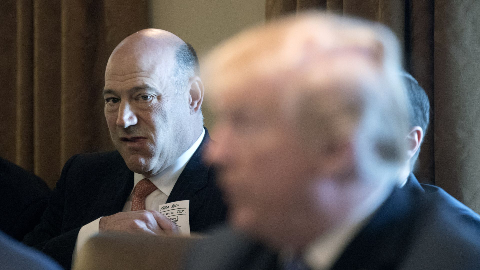 Gary Cohn sitting behind President Trump.