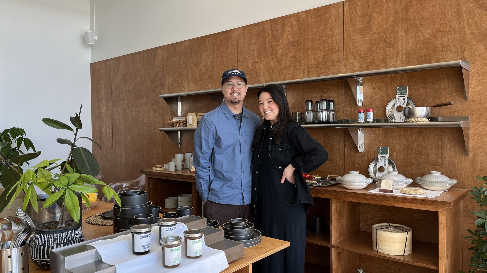 Nam Ho and Torri Myers standing in their shop