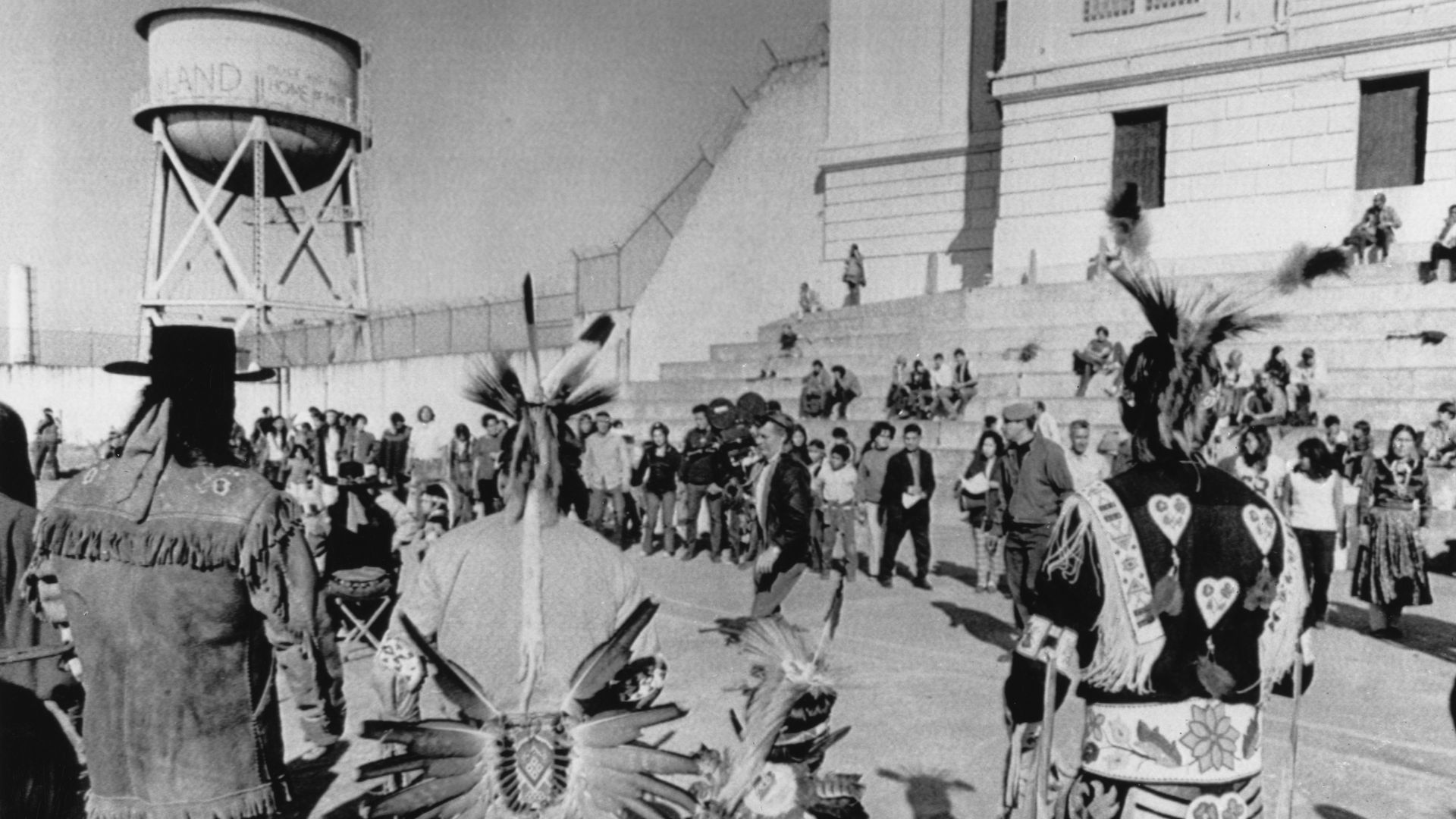 Photo of Native Americans gathered in front of a building on Alcatraz Island