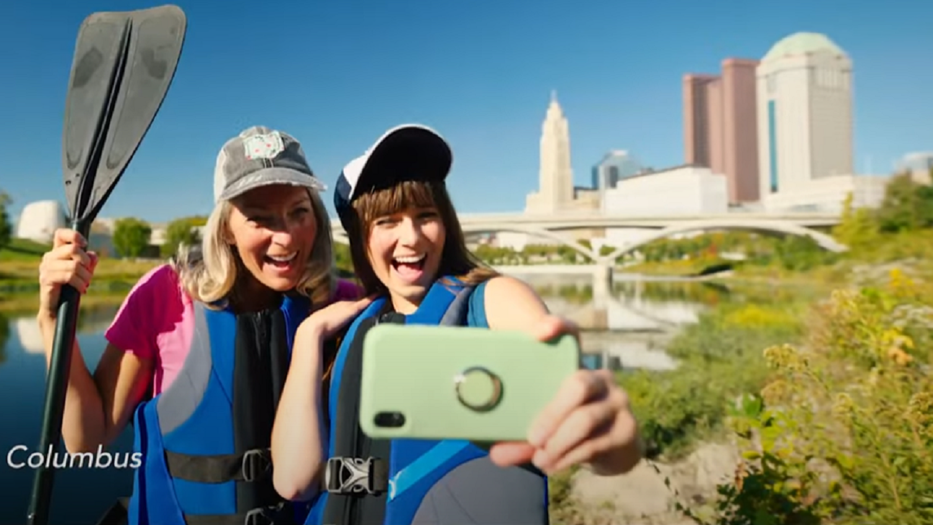 Actors in an Ohio promotional ad are seen taking a selfie at the Scioto River in Columbus.