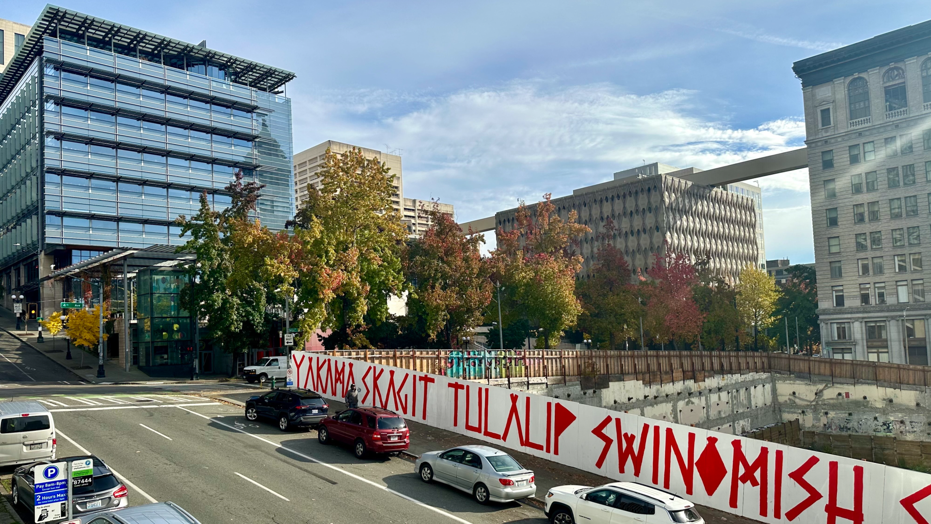 City Hall is shown overlooking the giant hole, with a view of the King County Administration Building in the distance.