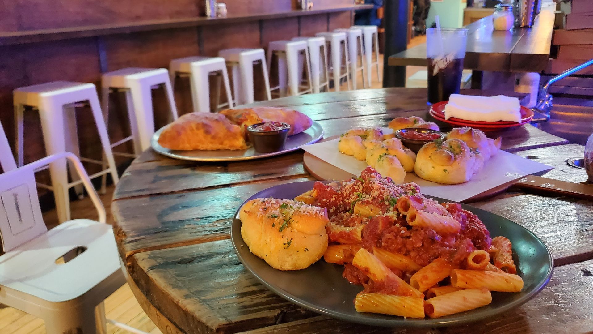 Plates of Italian food on a restaurant table. 