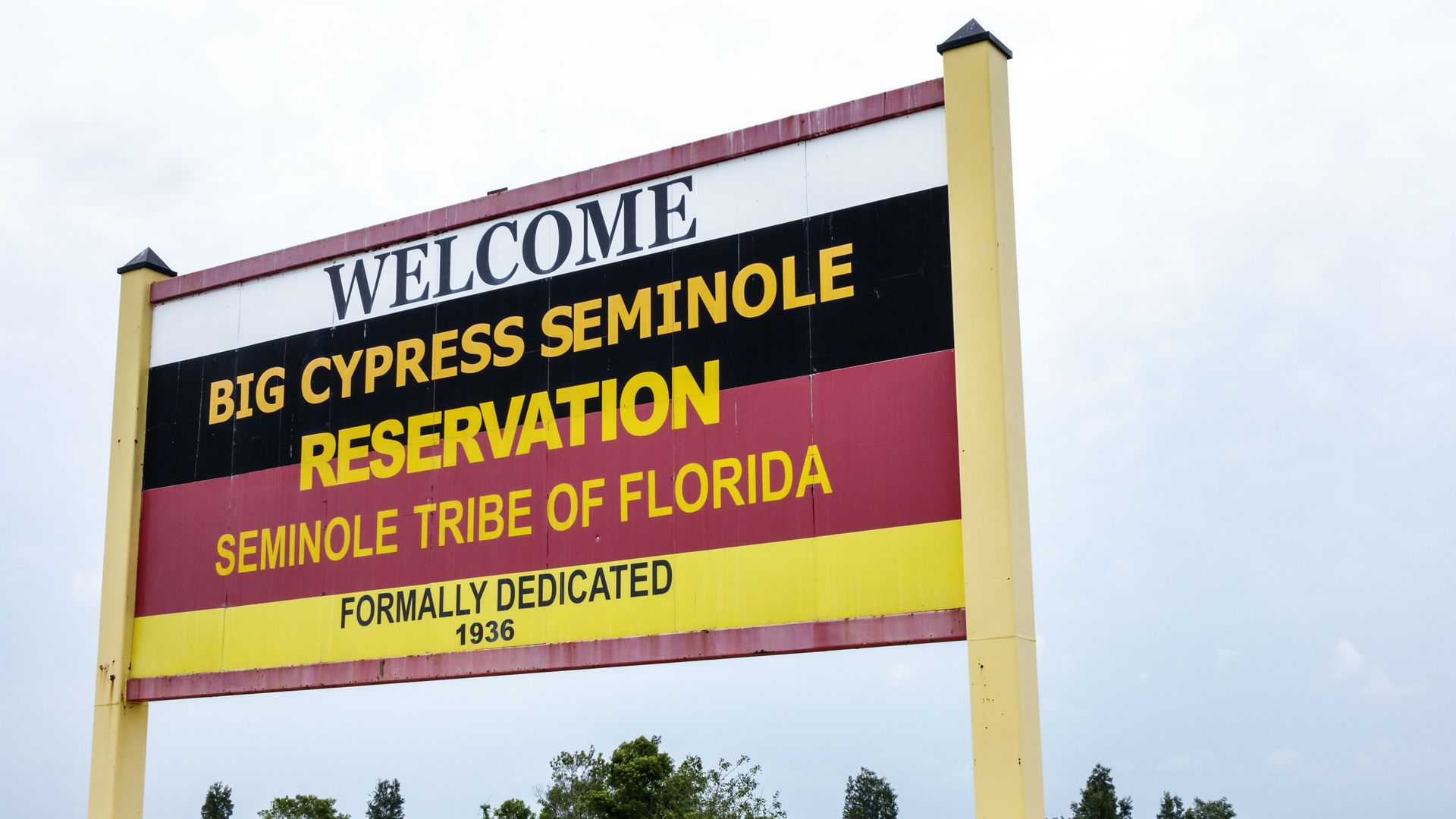 A black, white and red sign for the Big Cypress Seminole Reservation 