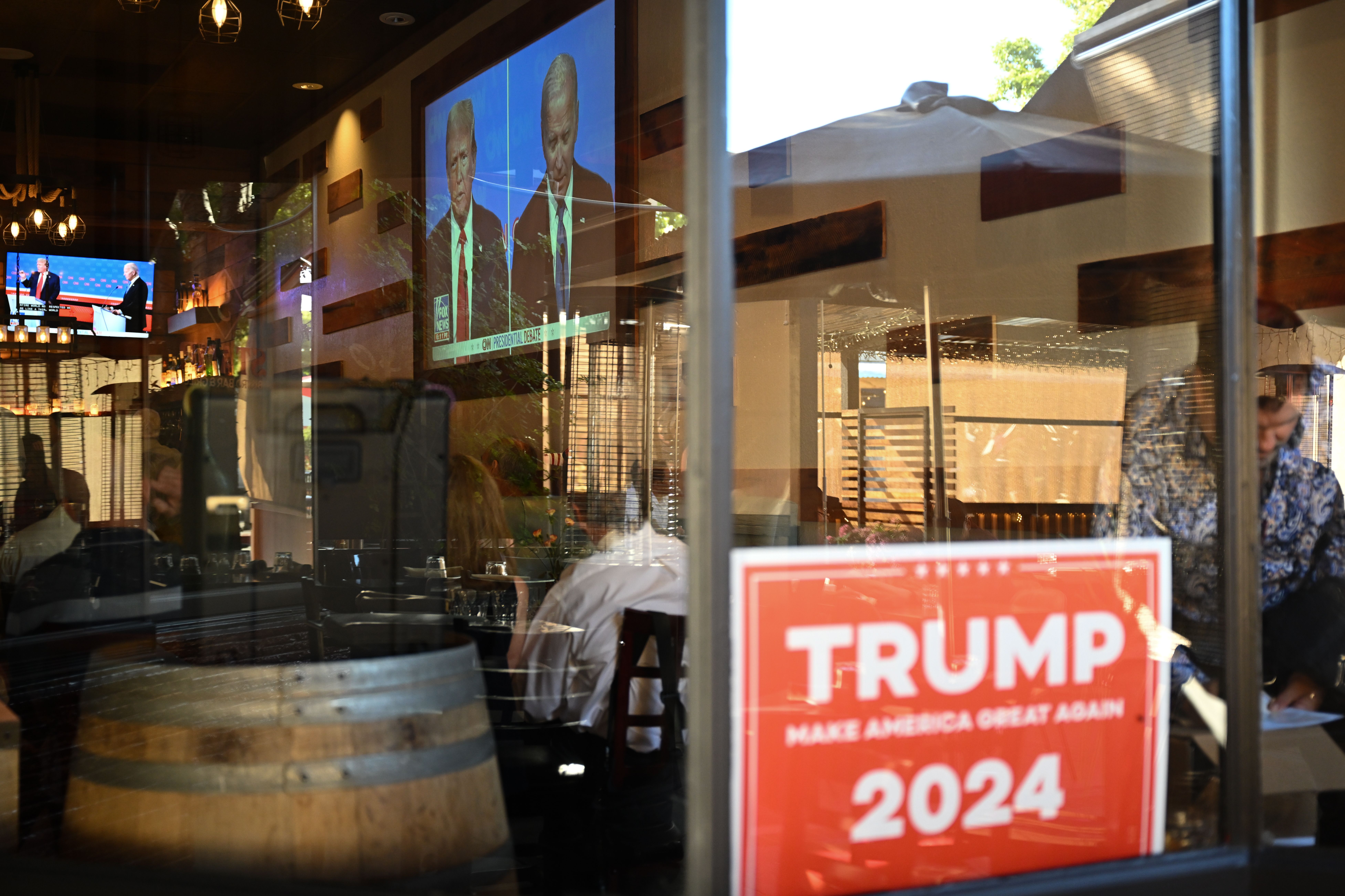   Republicans watch the 2024 Presidential Debate between Trump and Biden at a private event in San Carlos, California, United States on June 27, 2024.