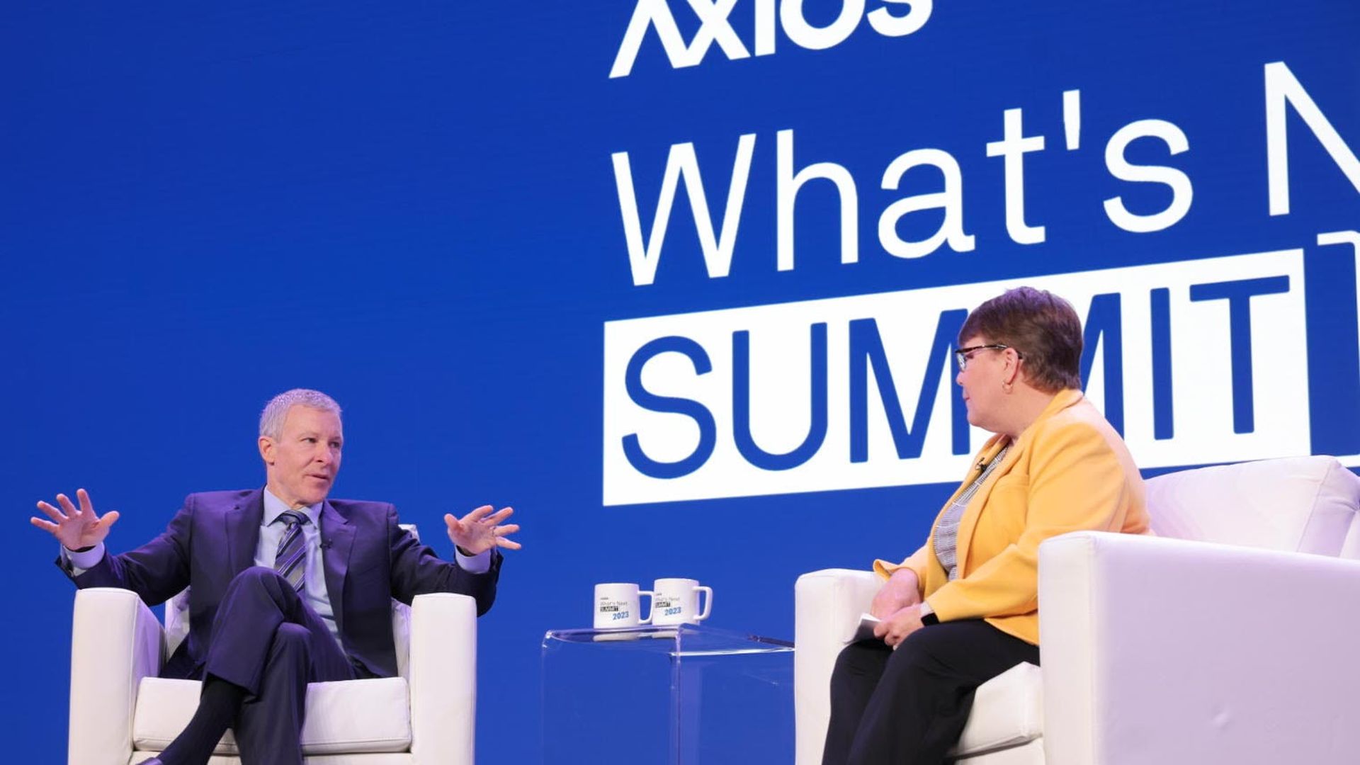 United CEO Scott Kirby (L) speaks with Axios' Joann Muller (R) at the What's Next Summit.