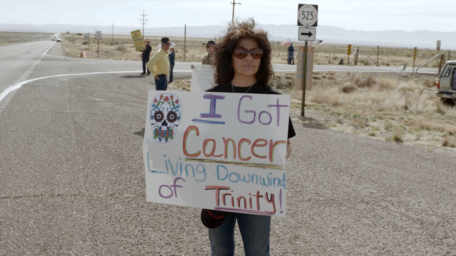 Tina Cordova, a cancer survivor and co-founder of the Tularosa Basin Downwinders Consortium, protests out of the Trinty Test site as shown in the documentary, "First We Bombed New Mexico."