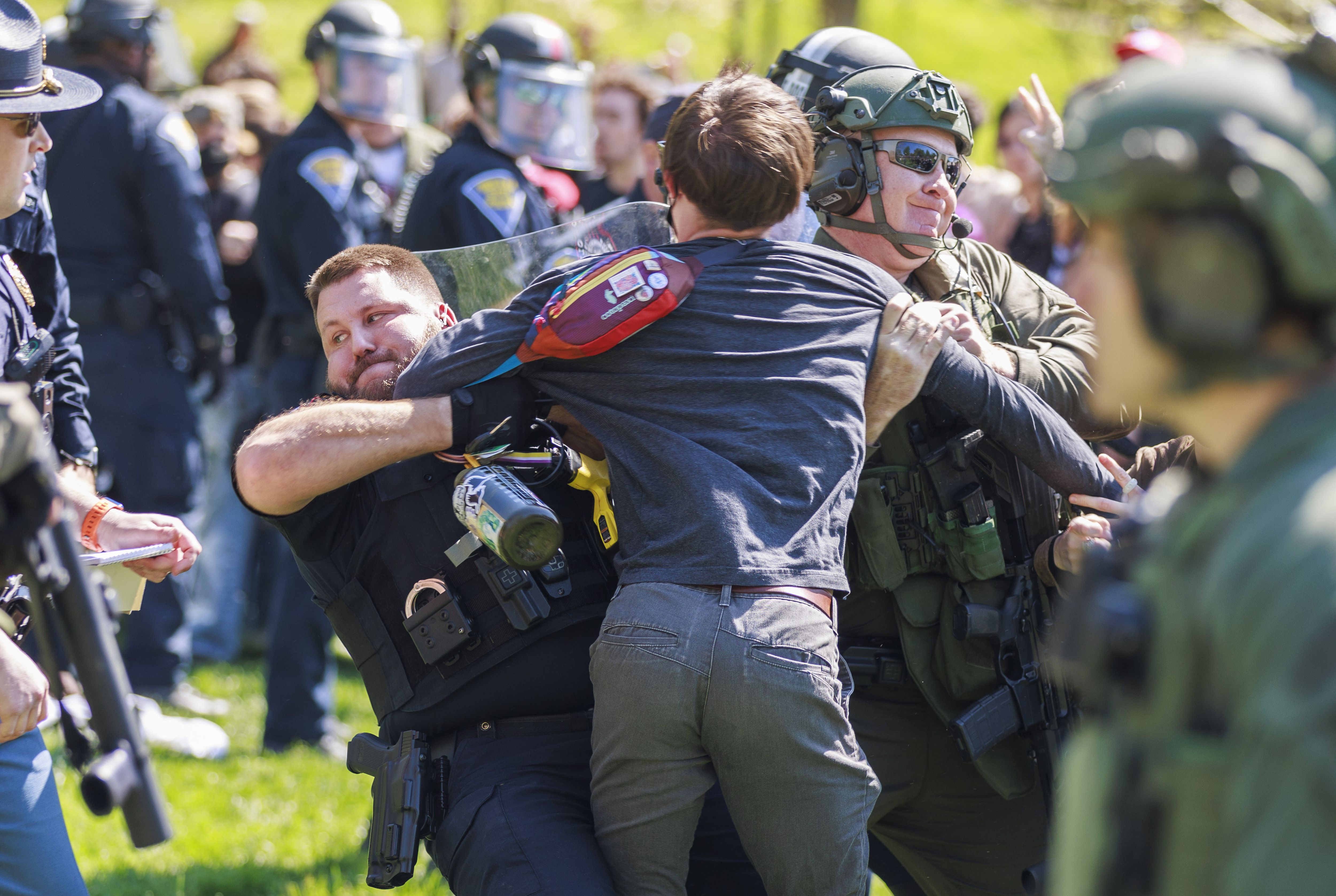 A police officer arresting protestors