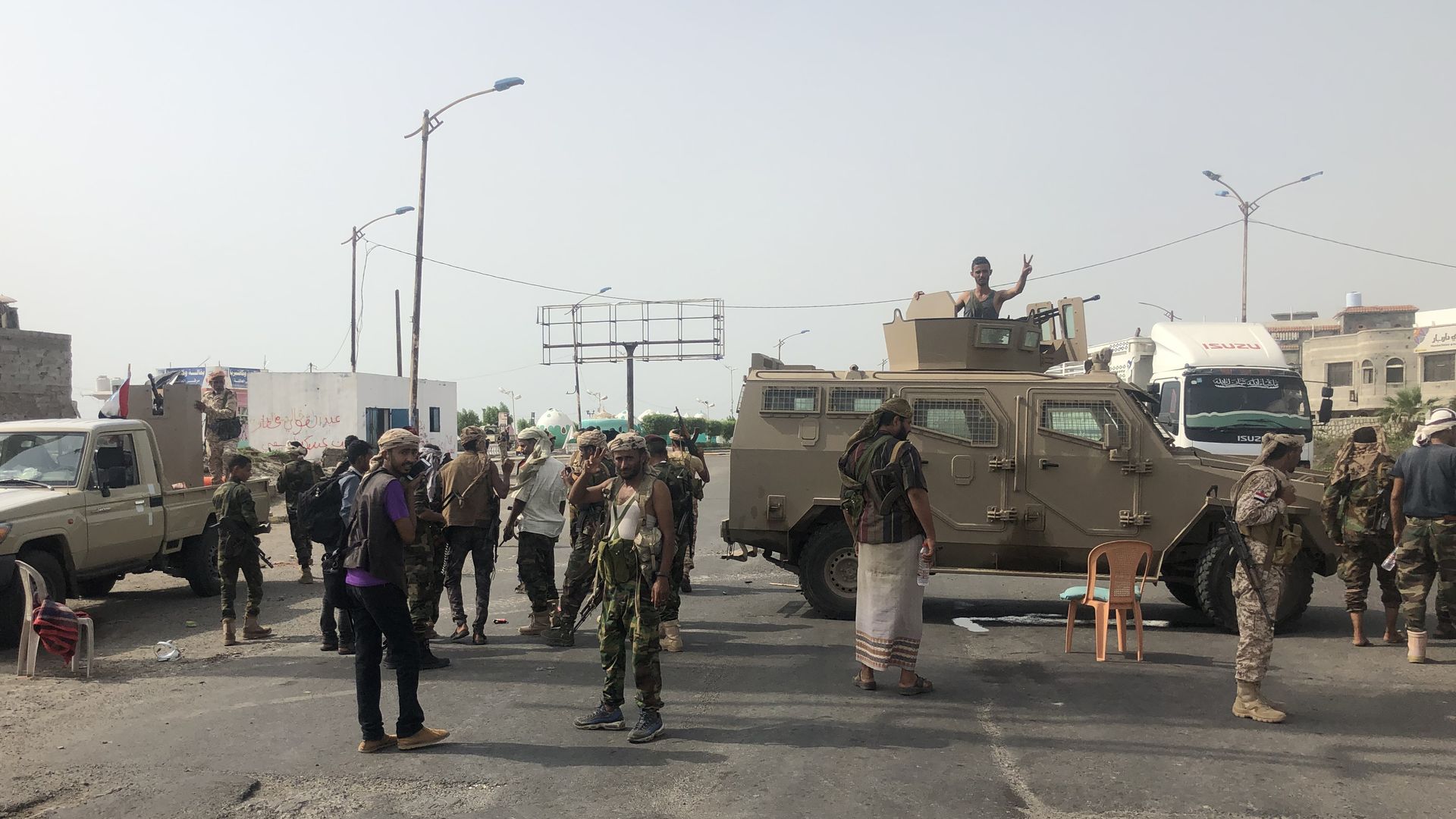separatist security forces with military vehicles in the middle of a road