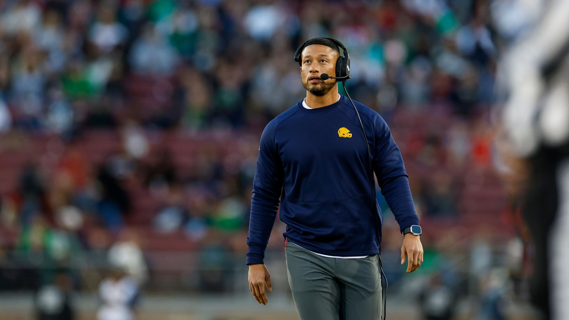 Notre Dame Fighting Irish head coach Marcus Freeman walks on the sideline during a game against the Stanford Cardinal at Stanford Stadium on November 25, 2023 in Stanford, California