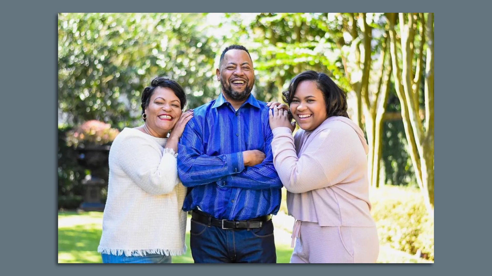 Photo shows LaToya Cantrell, husband Jason and daughter RayAnn smiling outside.