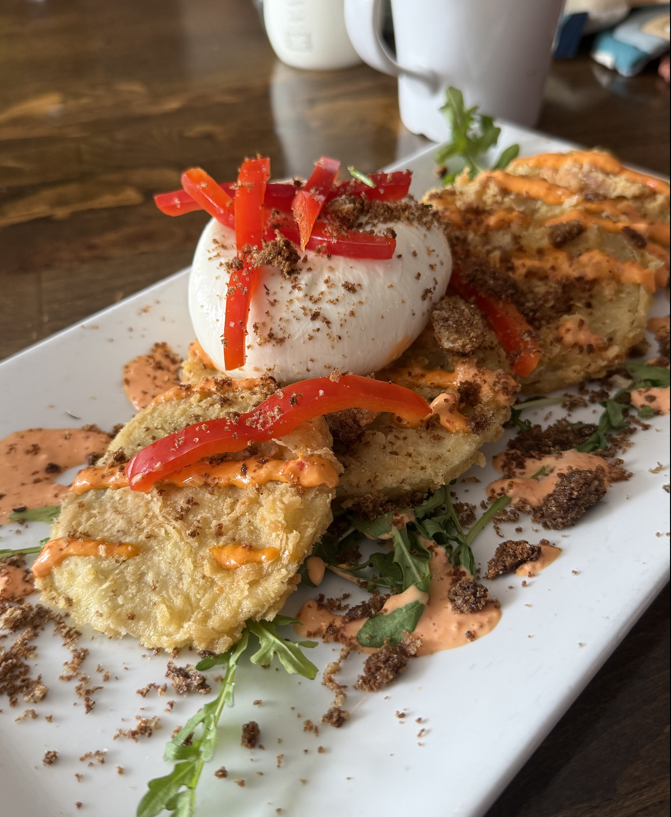 Fried green tomatoes with burrata on top
