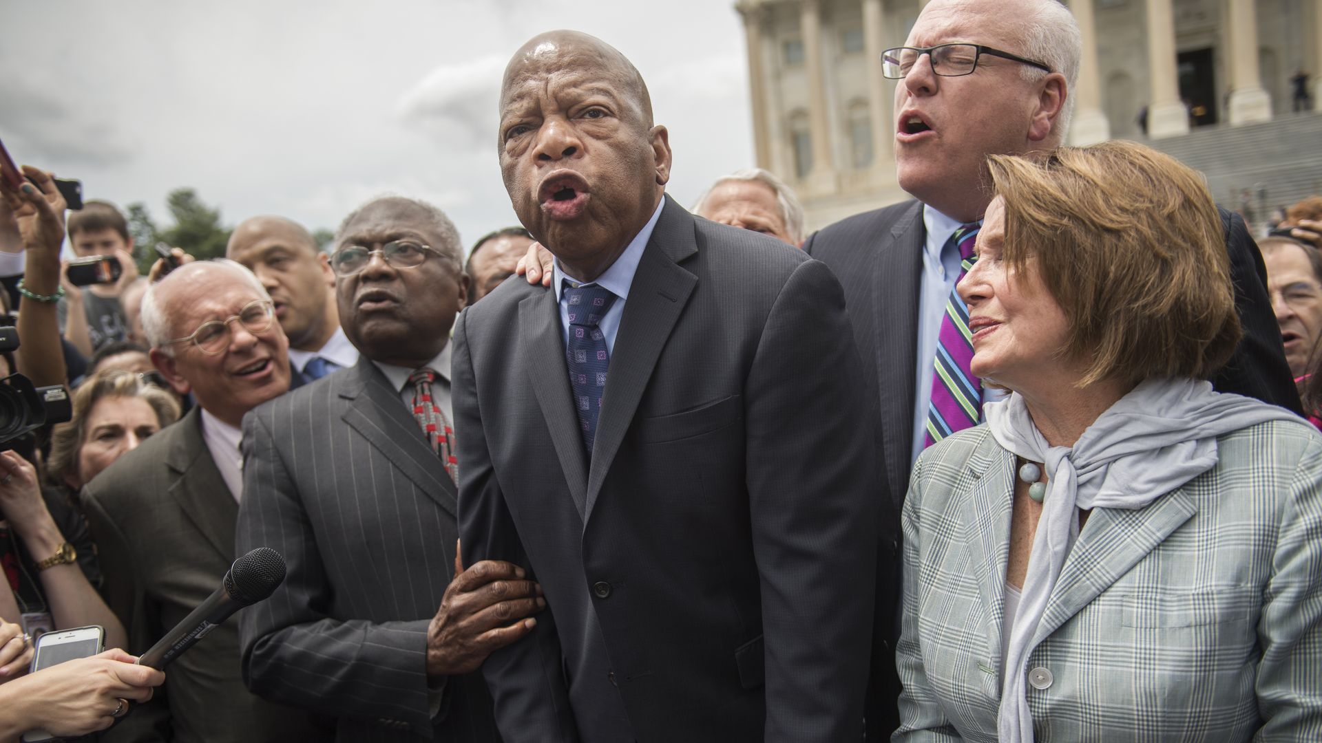 John Lewis, Nancy Pelosi and others, speaking at a rally.