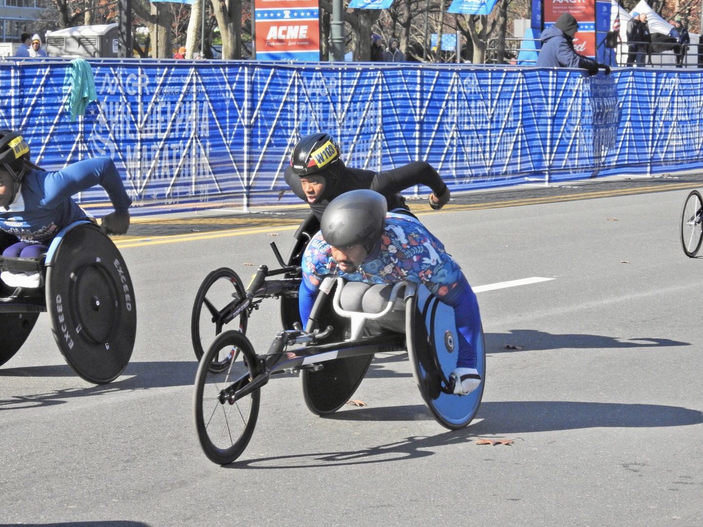 Athletes race in push wheelchairs in Philadelphia.