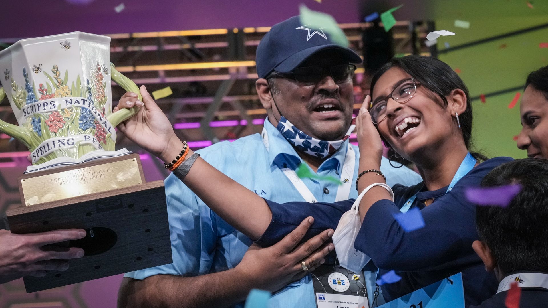 14-year-old Harini Logan from San Antonio, Texas is embraced by family after winning the Scripps National Spelling Bee.