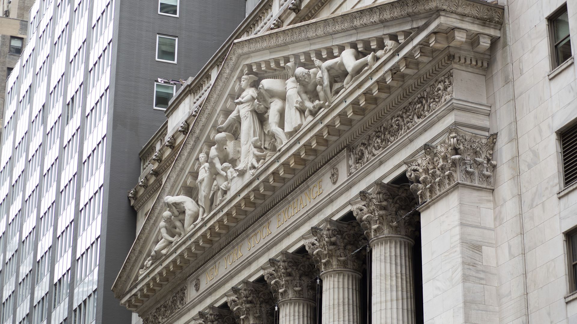 Exterior view of the New York Stock Exchange and Wall St.
