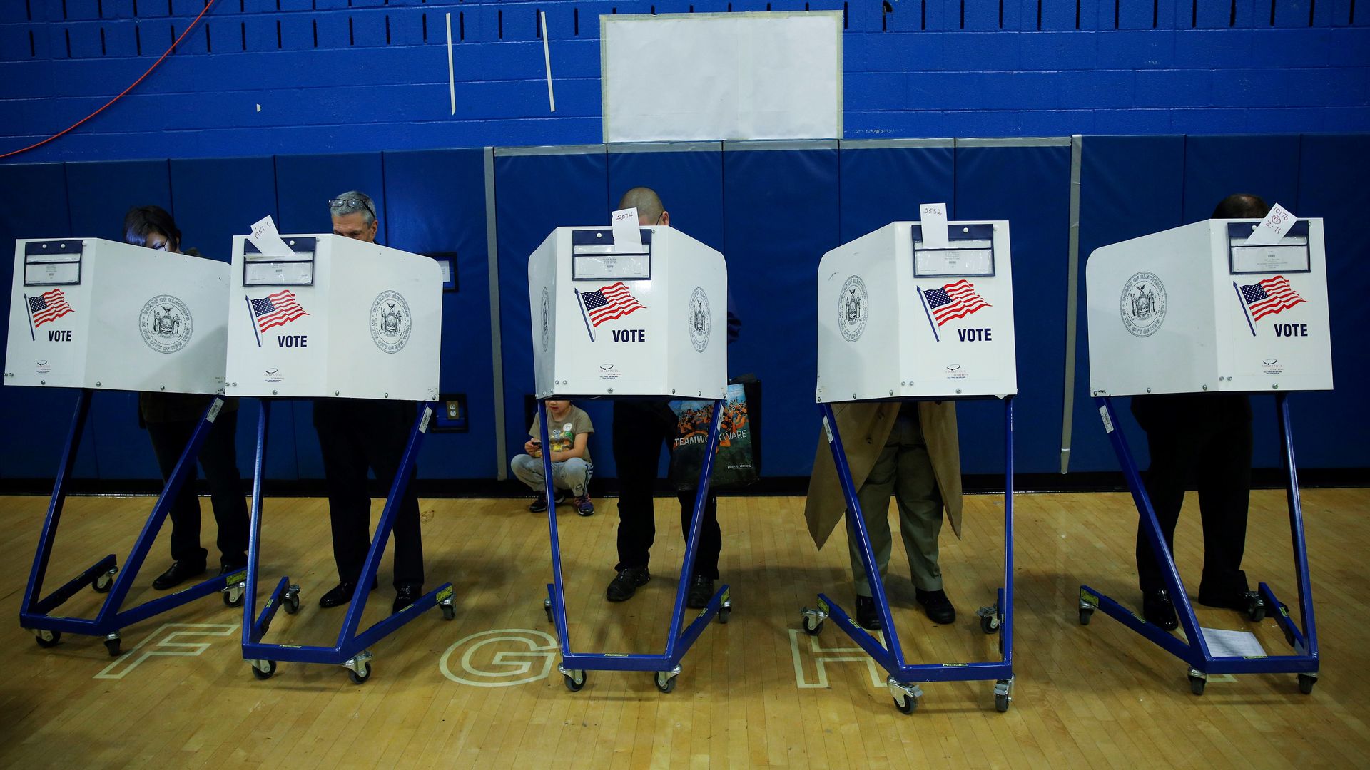Voters cast their ballots during the midterm election at the High School Art and Design polling station in Manhattan, New York, 