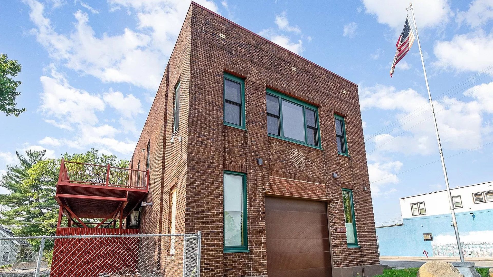 The exterior of a brick fire station.