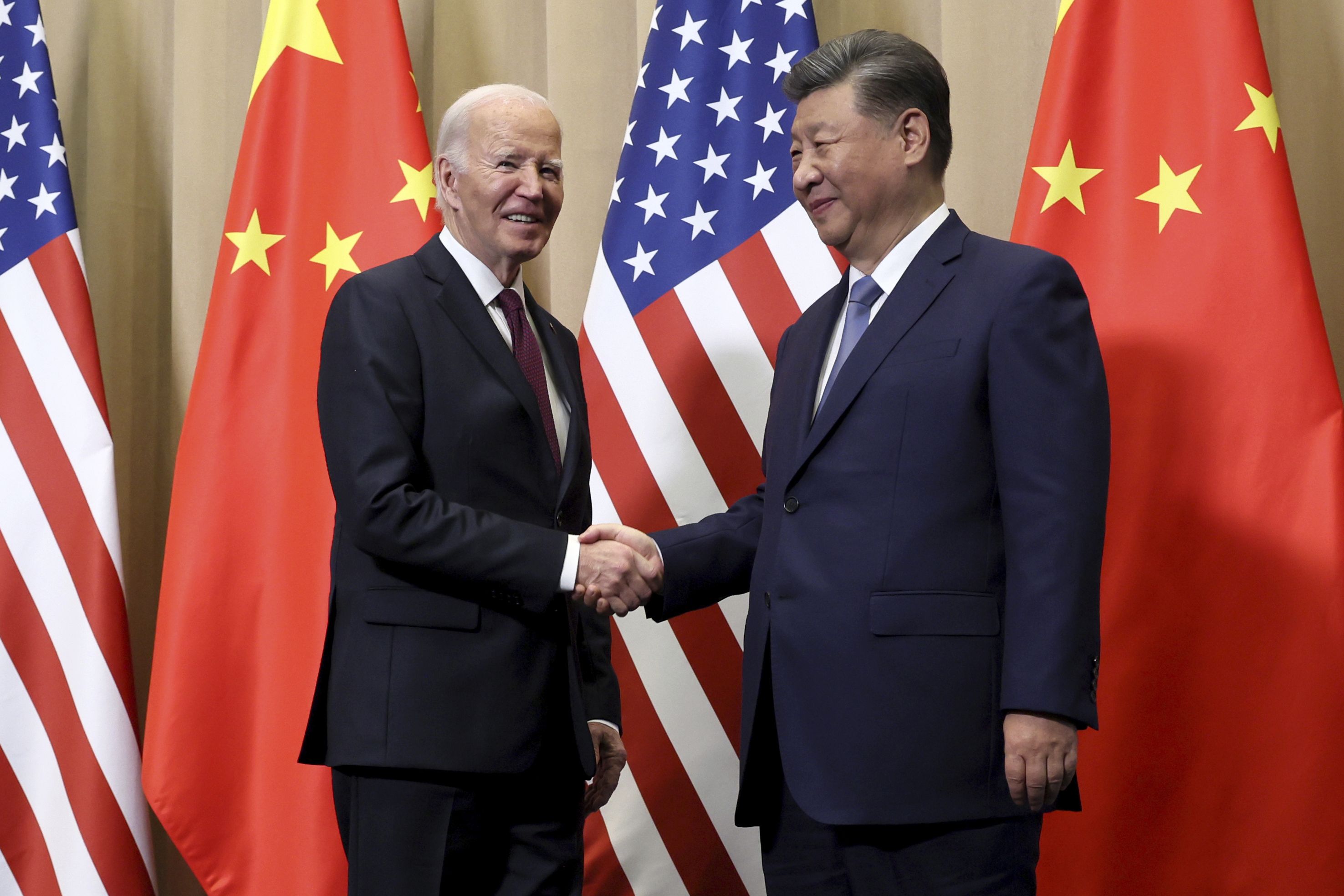 President Joe Biden shakes hands with Chinese President Xi Jinping before a bilateral meeting, Saturday, Nov. 16, 2024, in Lima, Peru. (Leah Millis/Pool Photo via AP)