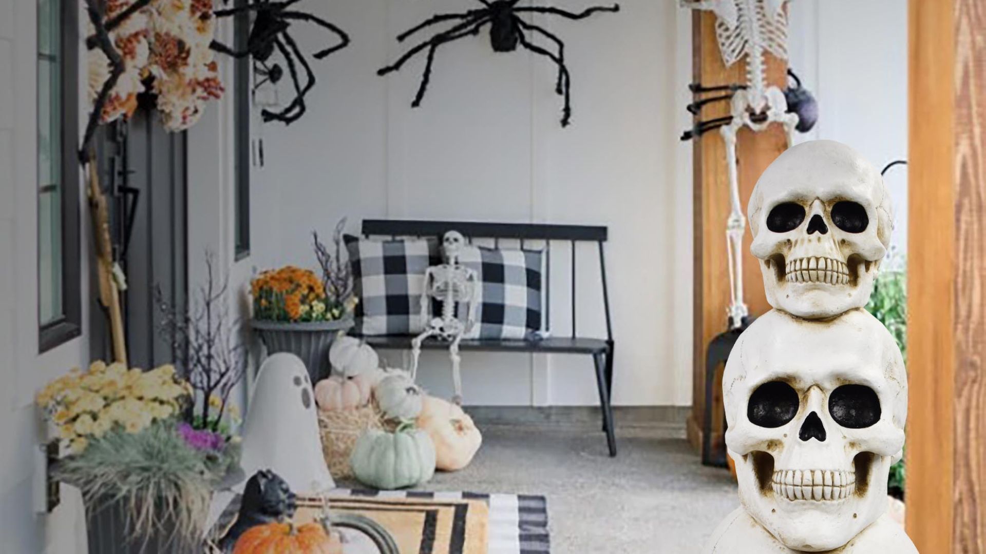 The patio of a house with halloween decorations including spiders, skulls, and skeletons. 