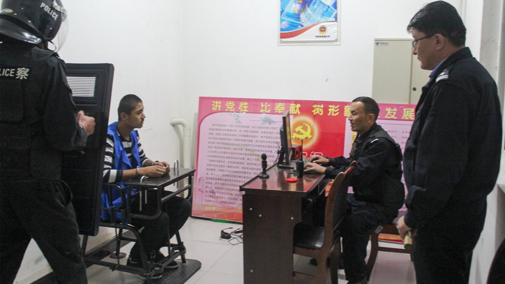 A man sits in a "tiger chair" in Tekes County Detention Centre in 2018