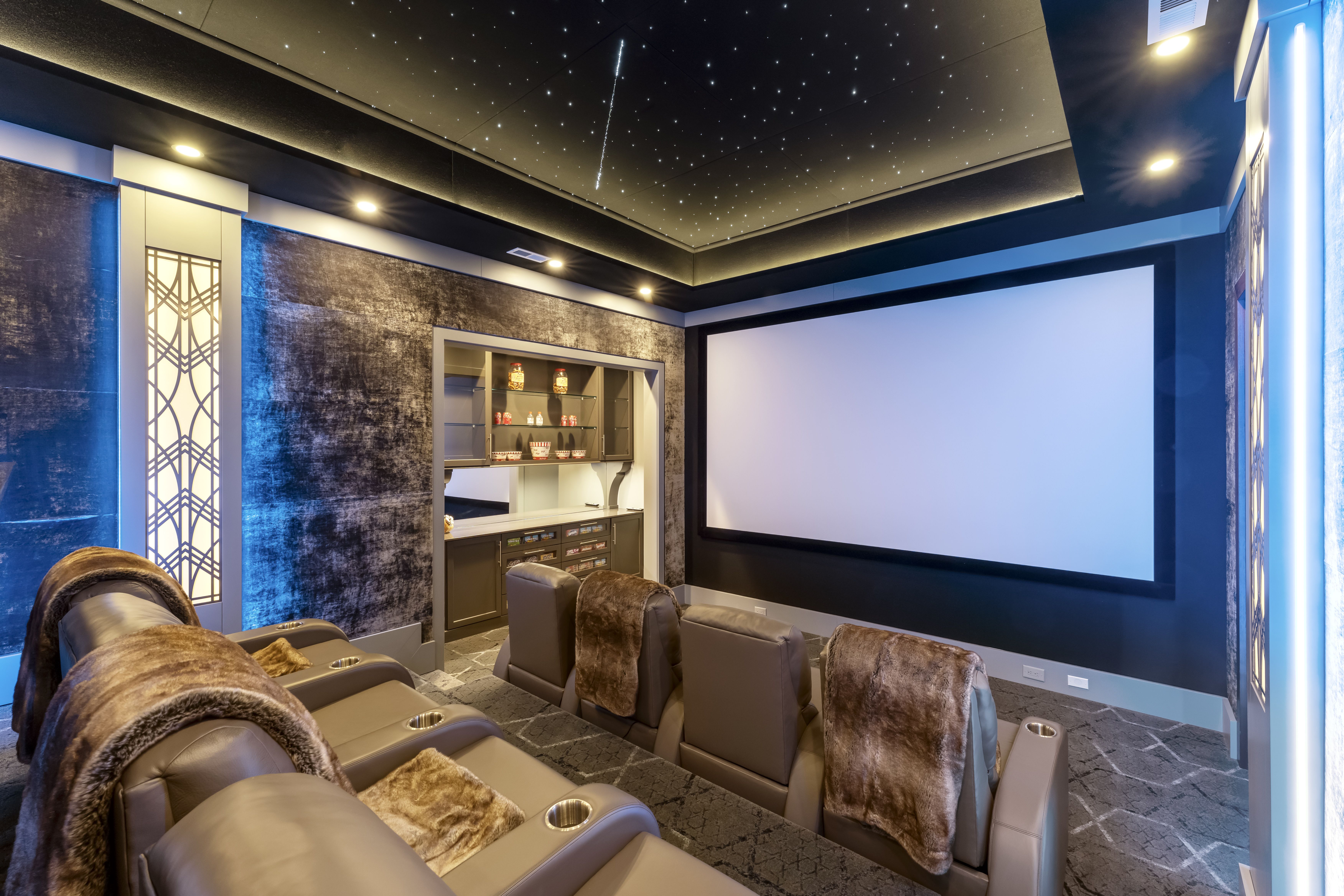 home theater with leather recliners and stars on the ceiling