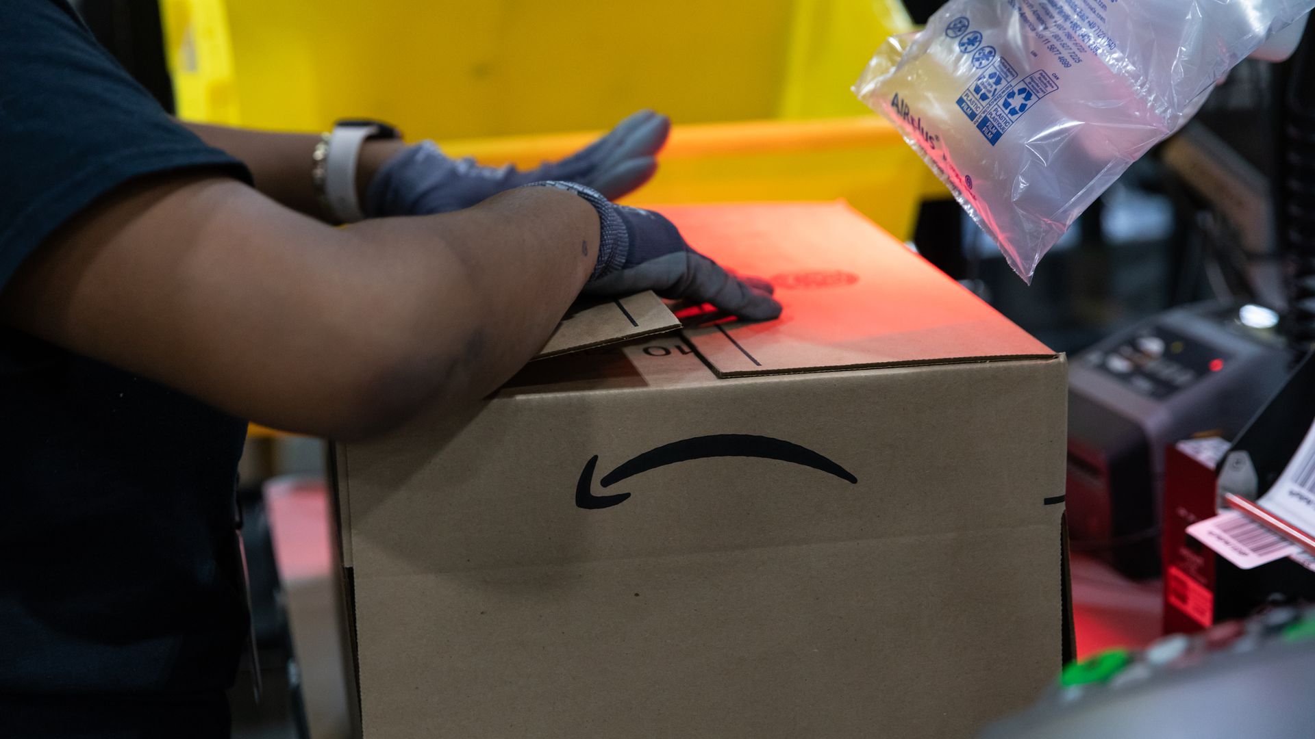 A worker assembles a box at an Amazon fulfillment center on Prime Day in Raleigh, North Carolina, U.S., on Monday, June 21, 2021. Amazon.com Inc.'s annual Prime Day sale, which begins Monday, arrives as the world grapples with the lingering effects of the pandemic. Photographer: Rachel Jessen/Bloomb
