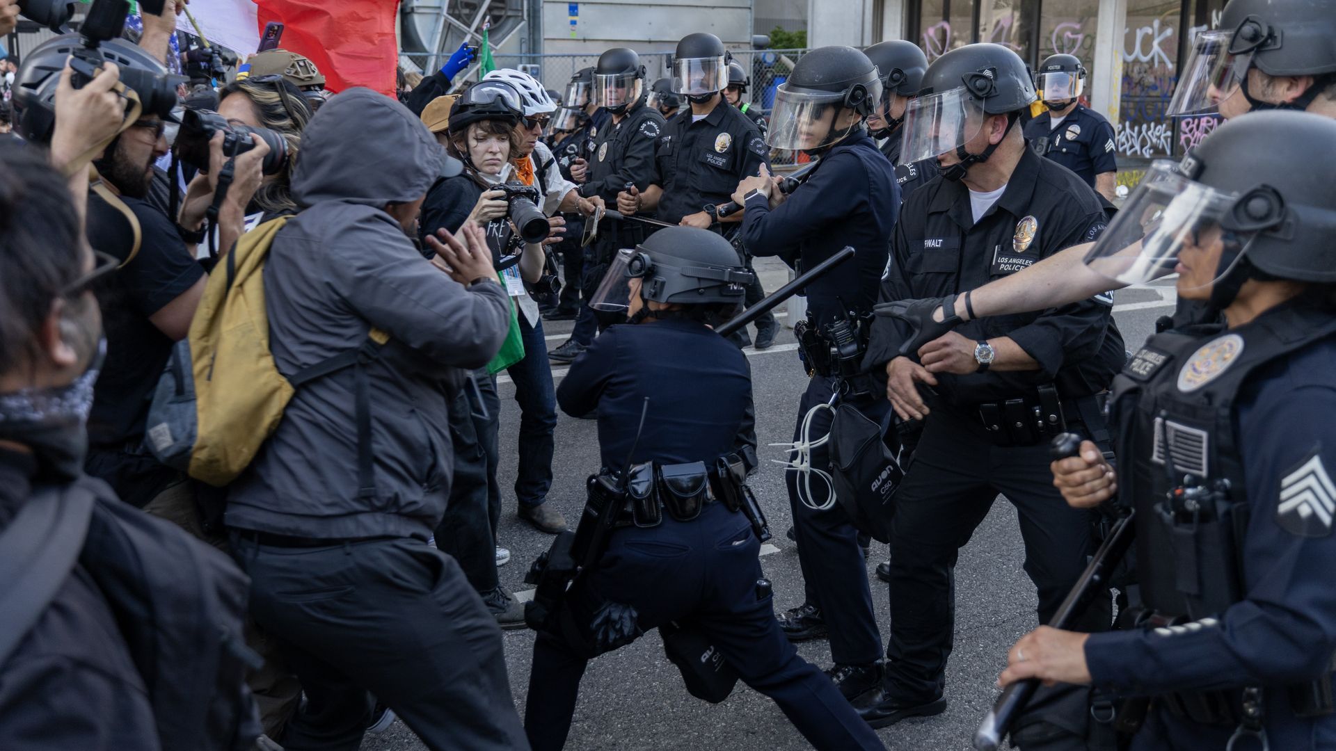 Protesters clash with police officers as protests continue in Los Angeles following three days of clashes with police after a series of immigration raids on June 09, 2025 in Los Angeles, California. Tensions in the city remain high after the Trump administration called in the National Guard against 