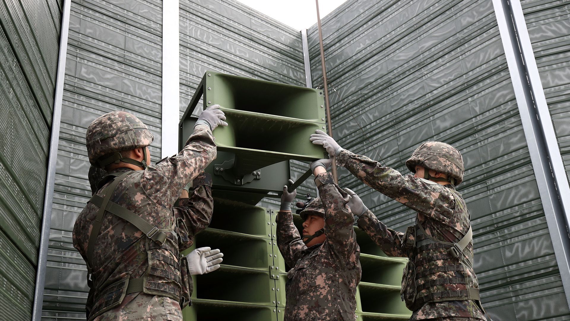 South Korean soldiers removing propaganda speakers